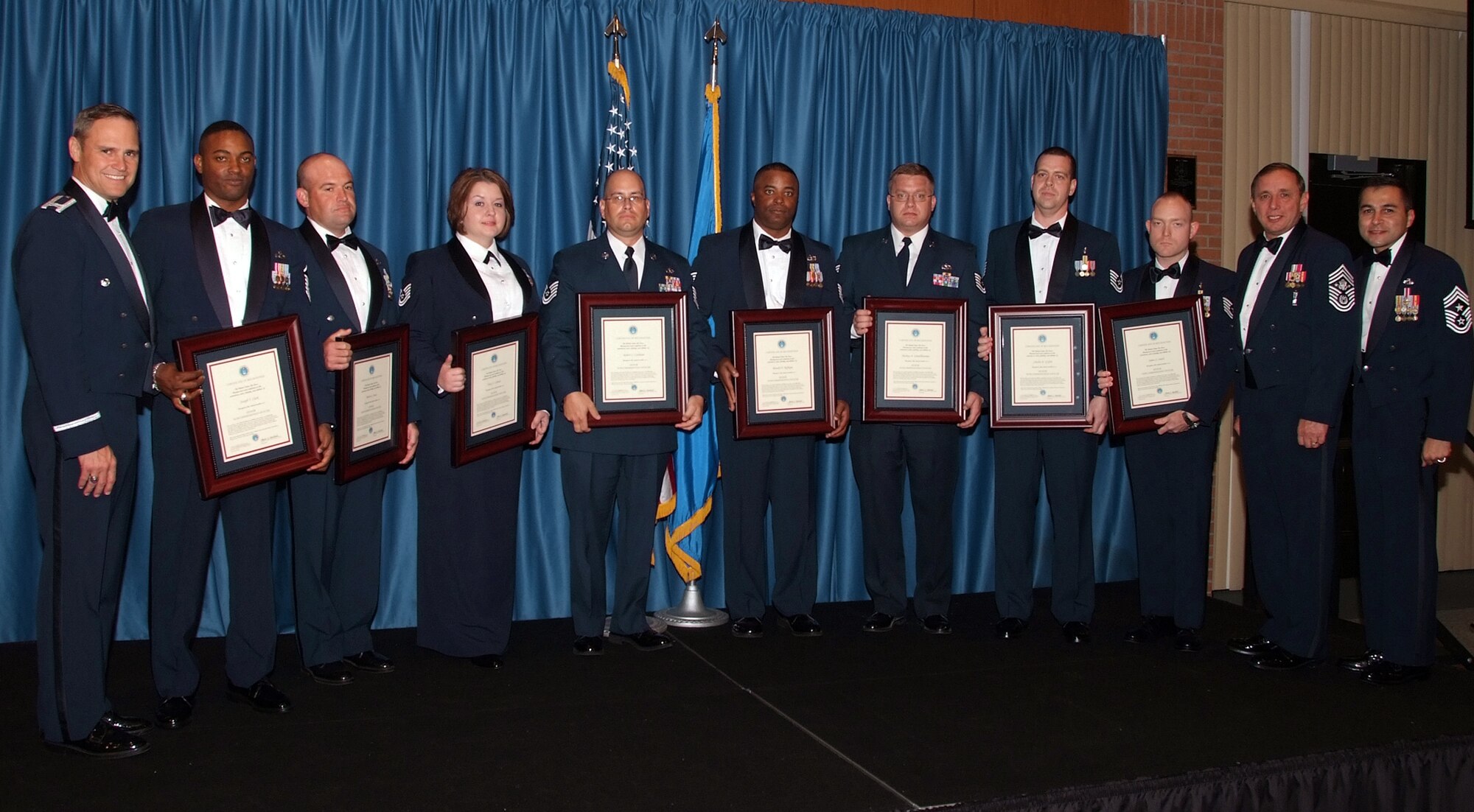 Eight Team Vance master sergeant and master sergeant selects were inducted into the senior NCO ranks during a ceremony held Sept. 24 at the Vance Collocated Club. From left to right: Col. Mark Nowland, 71st Flying Training Wing commander; Master Sgts. Joseph Clark and Robert Innis; Tech Sgts. Tracy Cabatit, Robert Caithaml, Ronald Feffegee, Markus Schnellhammer, Charles Griffis and James Smith; 13th Chief Master Sgt. of the Air Force Jim Finch; and Chief Master Sgt. Ruben Gonzalez, 71st FTW command chief. (U.S. Air Force photo by Terry Wasson)