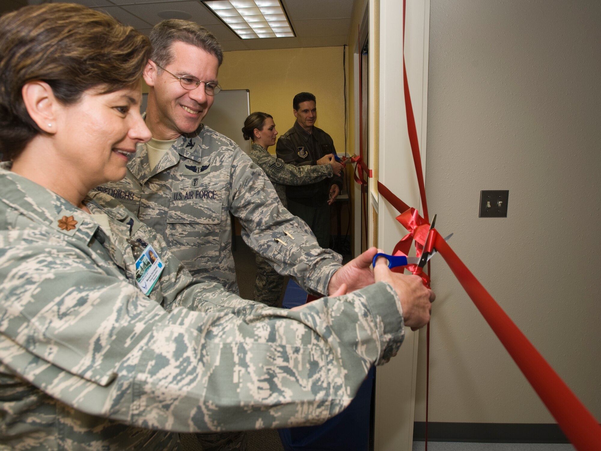 ELMENDORF AIR FORCE BASE Alaska -- Maj. Marlene Kerchenski, 3rd Medical Group, and Col. Paul Friedrichs, 3rd MDG commander, cut the ribbon to one of two newly built simulation lab. The new labs will provide real-world scenario training for all medics from doctors to nurses to technicians. (U.S. Air Force photo/Staff Sgt. Joshua Garcia)