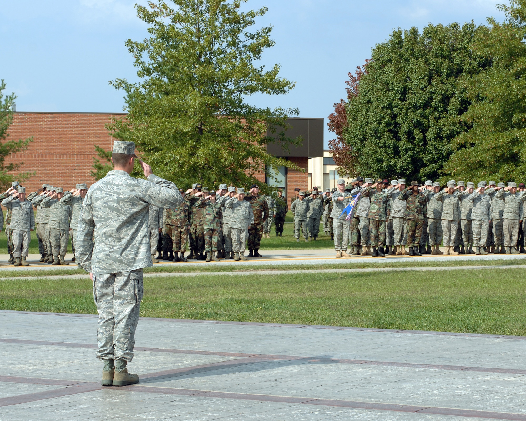 WHITEMAN AIR FORCE BASE, Mo. -Members of Team Whiteman salute during the annual Prisoner of War/Missing in Action ceremony Sept. 19.  More than 150 members of Team Whiteman participated in the ceremony. (U.S. Air Force photo/Staff Sgt Charles D. Larkin Sr.)
