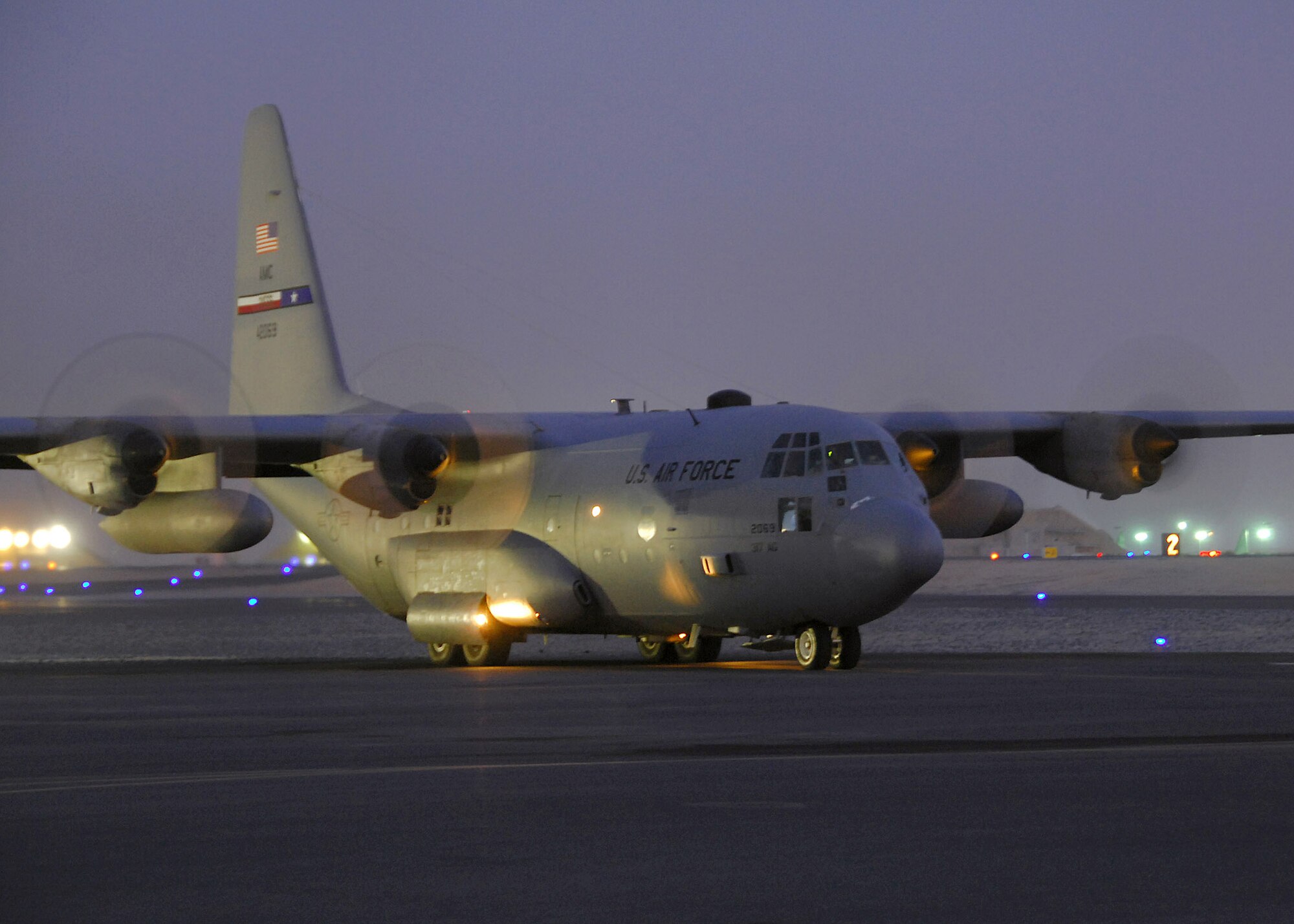 A C-130 Hercules assigned to a Southwest Asia base prepares to depart on a sortie en route to Iraq. C-130s  transport passengers and cargo in support of Operations Iraqi and Enduring Freedom. (U.S. Air Force photo/Tech. Sgt. Raheem Moore)