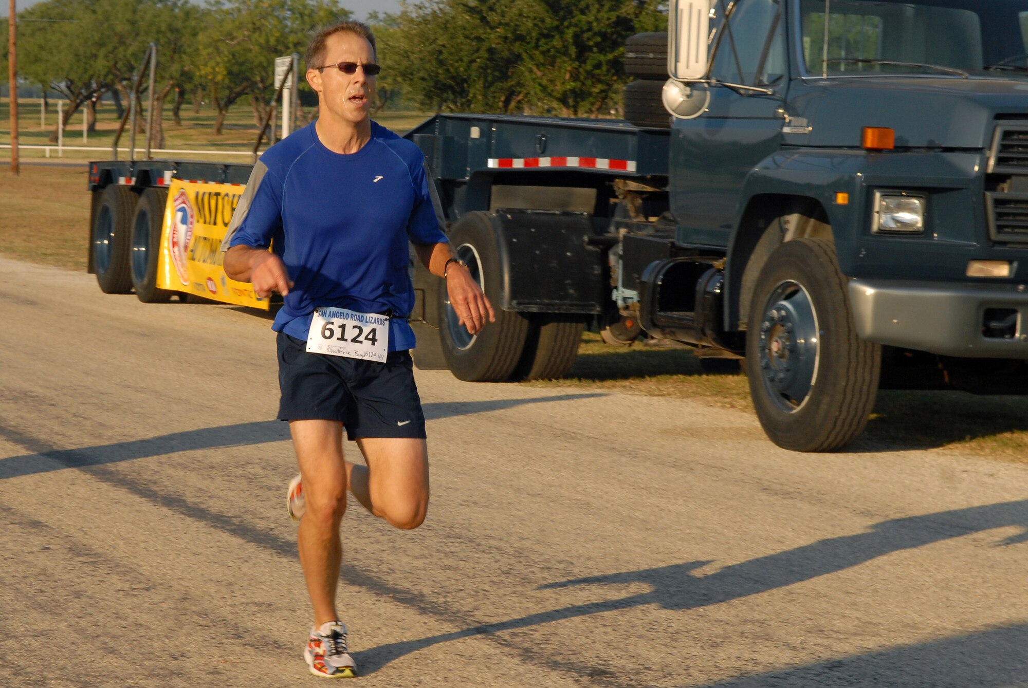 Boyd Guthrie crosses the finish line as the top overall finisher of the 10 kilometer race portion of the 2008 ArmyDillo Run at Mary E. Lee Park in San Angelo, Texas, Sept. 27.  More than 350 people participated in the annual event, which benefits the Sentinel Foundation and consists of a 10-kilometer race, a two-mile individual race, a two-mile team race, and a two-mile military formation race. Mr. Guthrie won the 10 kilometer race with a time of 43:52:00.  (U.S. Air Force photo by Senior Airman Kasabyan Musal)