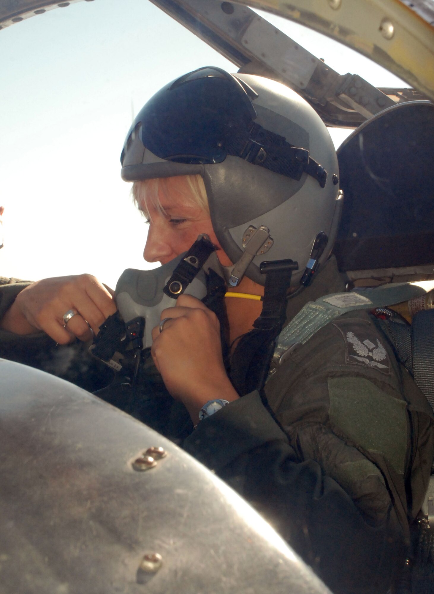 Tina Helet, the spouse of a German pilot, dons her helmet and mask as she prepares to be taxied in a T-37 Tweet during Spouse Taxi Day Sept. 30. Spouse Taxi Day is an annual tradition that gives the spouses of instructor pilots the opportunity to be a passenger in Sheppard's aircraft. (U.S. Air Force photo/Airman 1st Class Candy Miller)
