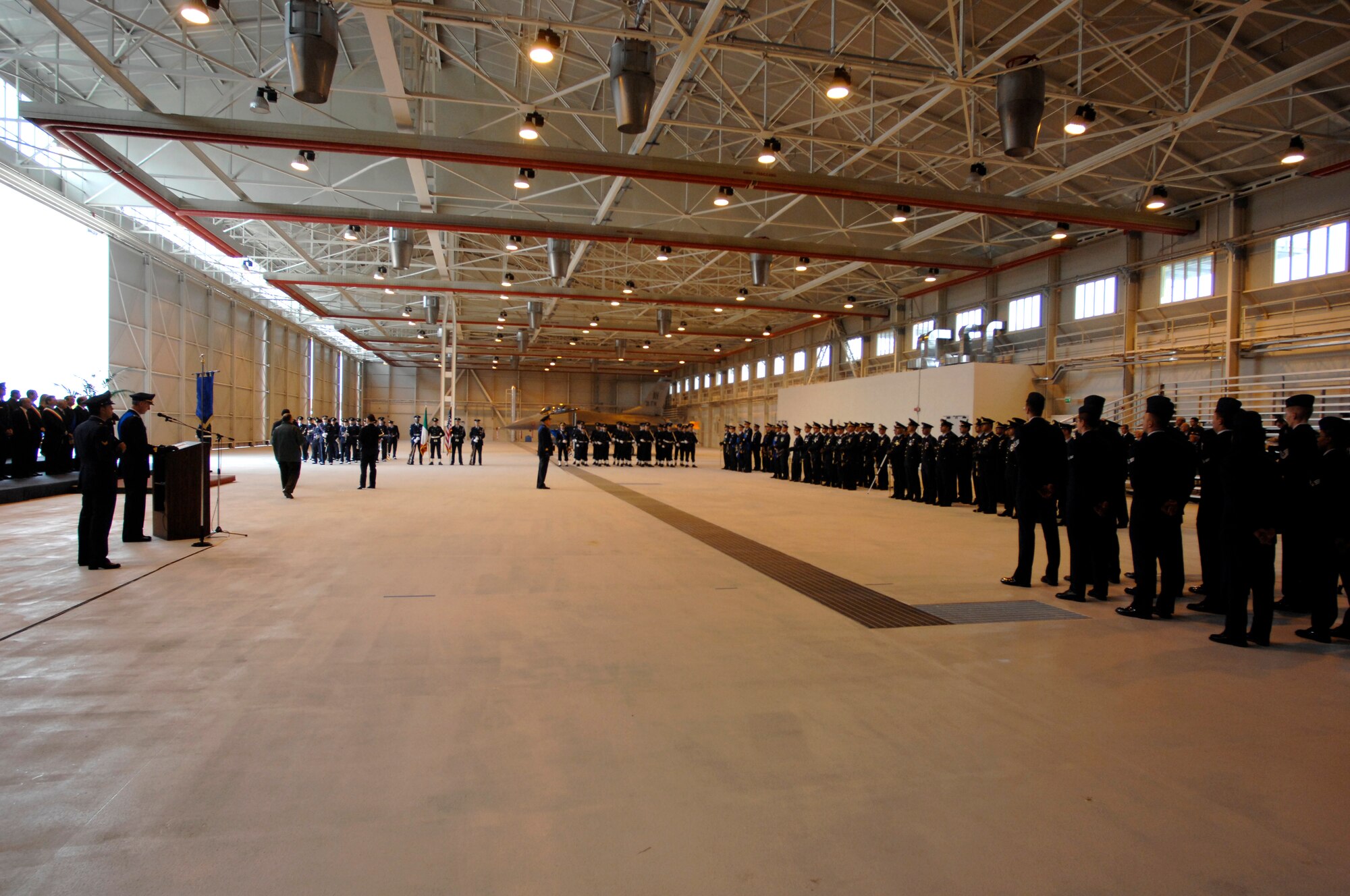 Formations of U.S. and Italian military service members get into position for the Italian Air Force "Pagliano e Gori" Airport change of command ceremony held in Hangar 3 on Aviano Air Base Sept. 30. (U.S. Air Force photo/Airman 1st Class Ashley Wood)