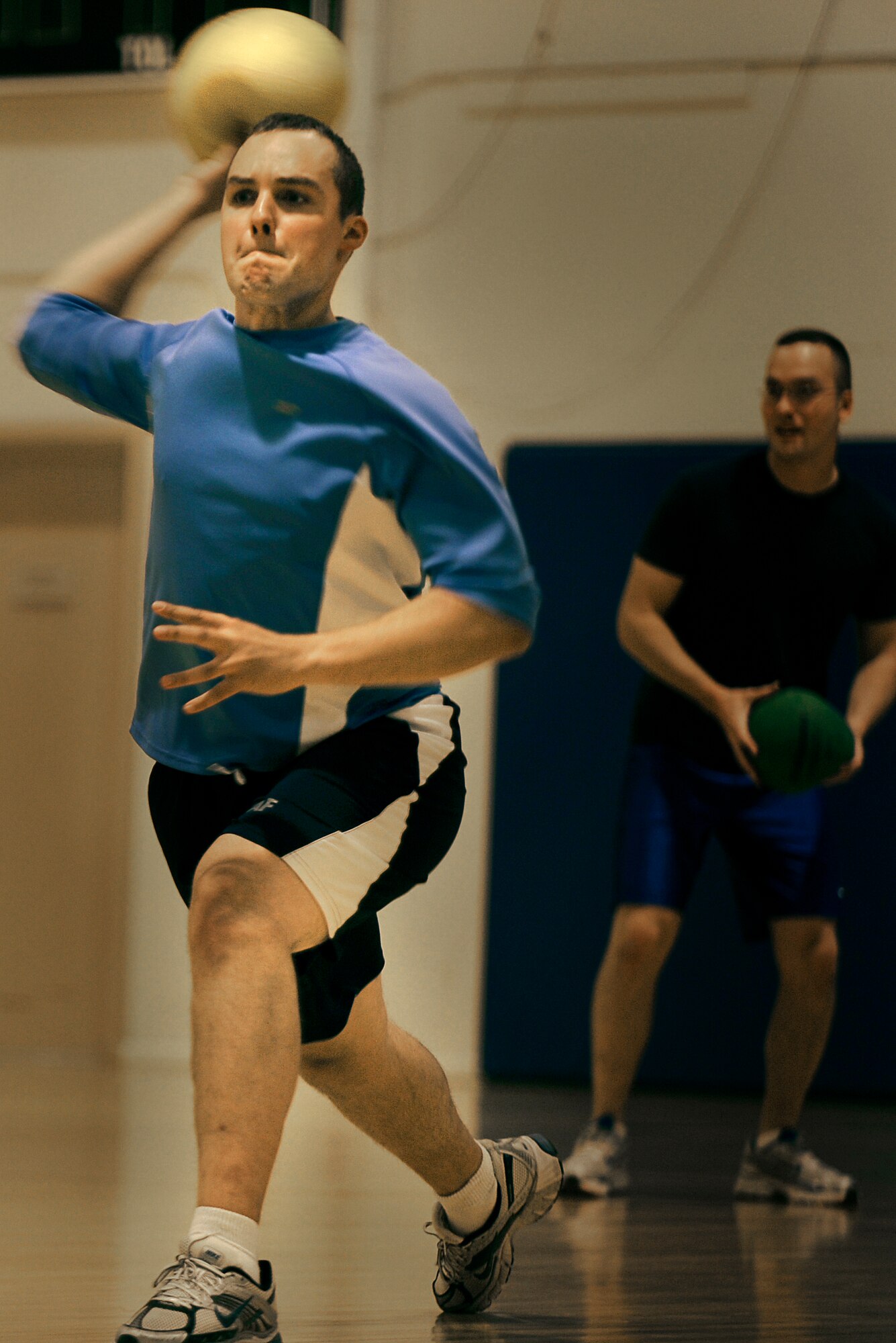 MOUNTAIN HOME AIR FORCE BASE, Idaho-- Staff Sgt. Joseph Koczarski and Senior Airman Zachariah Fair, both from the 366th Communications Squadron, compete in a dodgeball game Sept. 24 at the base fitness center. The game was part of sports day, used to promote fitness, and included volleyball, wallyball, racquetball and dodgeball competitions. (U.S. Air Force photo/Airman 1st Stephany Miller)