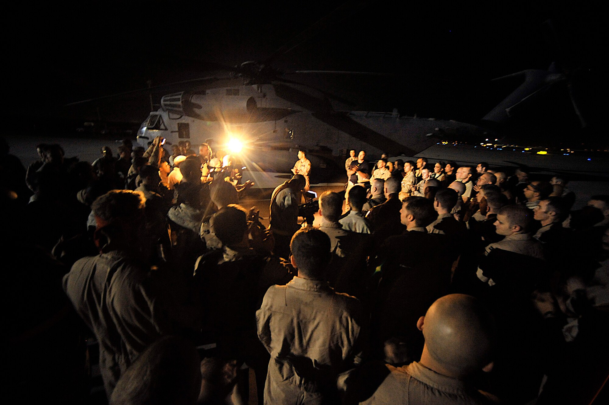 Lt. Col. Gene Becker speaks to the crews and maintainers after the last combat mission of the MH-53 Pave Low Sept. 28 in Iraq. The 20th ESOS MH-53 helicopters and their crews provided much of the vertical lift, direct action and logistical resupply to the Combined Joint Special Operations Task Force in Iraq. Colonel Becker is the 20th Expeditionary Special Operations Squadron commander. (U.S. Air Force photo/Staff Sgt. Aaron Allmon) 
