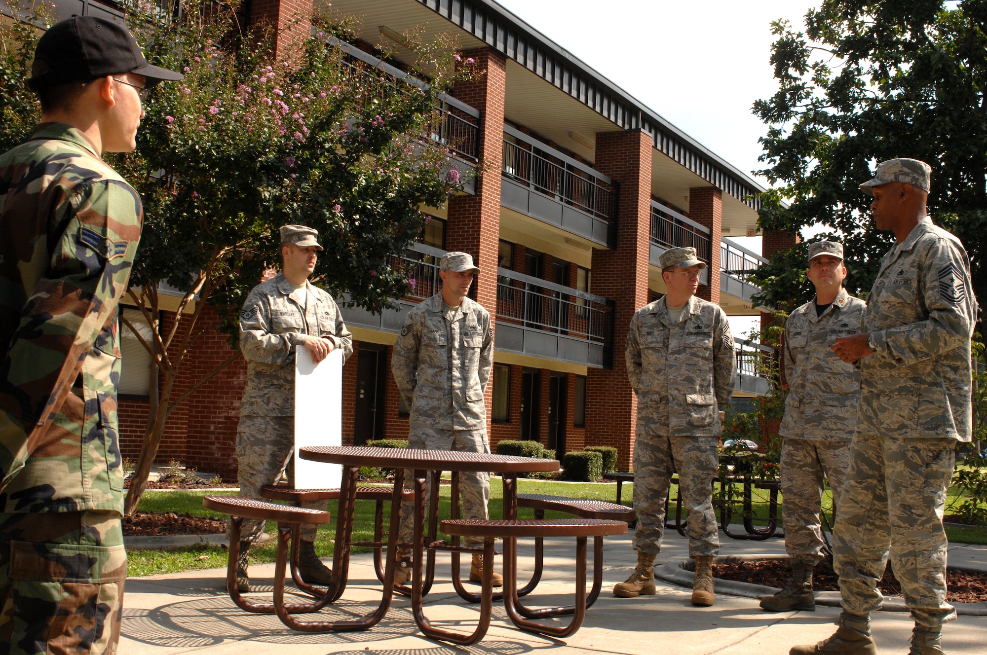 Chief Master Sgt. Leroy Frink, 4th Fighter wing command chief master sergeant, gives a speech to the dorm council of building 3616 after presenting them a check worth $ 10,000 for winning dorm of the quarter. Chief Frink discusses how attention to detail makes a dorm stand out during the inspections. (U.S. Air Force photo by Airman 1st Class Gino Reyes)