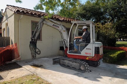 Julio Torres, a subcontractor for Pinnacle, breaks up concrete on a driveway in preparation to pour a new slab Sept. 30. (U.S. Air Force photo by Rich McFadden)