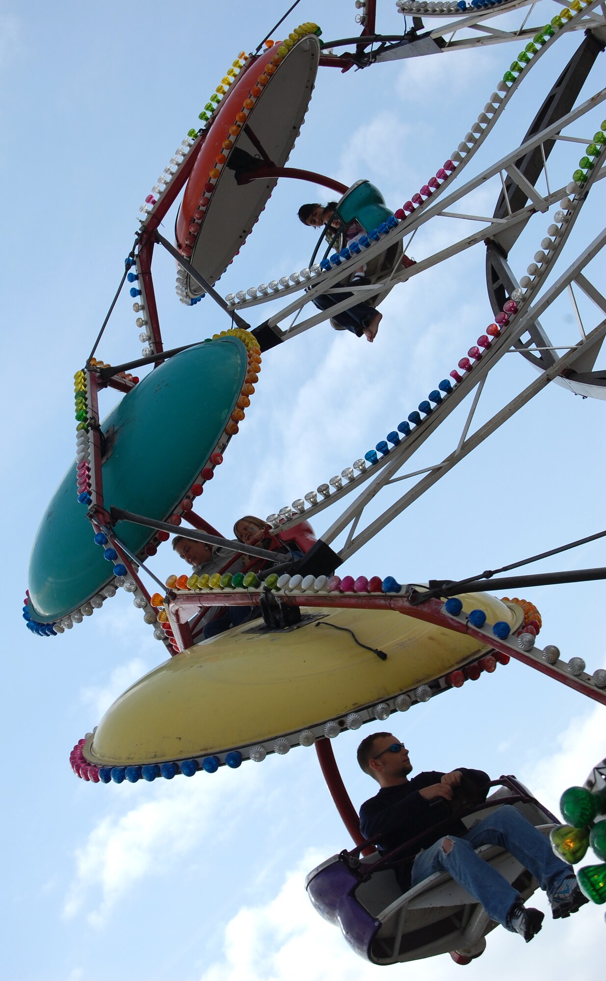 RAF Lakenheath family members enjoy one of several rides during the base’s annual Holiday Bazaar, Sept. 28. More than 100 vendors from the local attended the Bazaar Sept.  26 to 28. The Holiday Bazaar is hosted by the Officer and Civilian Spouses club and Enlisted and Civilian Spouses club. (Air Force photo by Senior Airman Stacy Sanchez)
