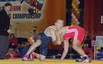 Steve Horton, a master sergeant with the 12th Flying Training Wing Public Affairs office, attempts a takedown of Turkish wrestler Ahmet Durna during a preliminary match in the 2008 World Veteran Wrestling Championship in Perm, Russia on Sept. 26. (Courtesy photo) 