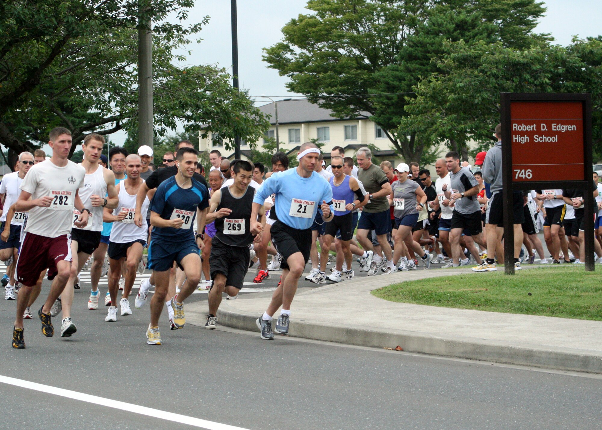 MISAWA AIR BASE, Japan -- Approximately one hundred runners from the 2nd annual Misawa Flyer Race, jog by Edgren High School , Sept. 20, 2008.  Both military and Japanese nationals competed in the event.  (U.S. Air Force photo by Senior Airman Chad Strohmeyer)