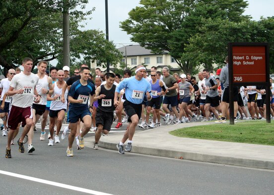 MISAWA AIR BASE, Japan -- Approximately one hundred runners from the 2nd annual Misawa Flyer Race, jog by Edgren High School , Sept. 20, 2008.  Both military and Japanese nationals competed in the event.  (U.S. Air Force photo by Senior Airman Chad Strohmeyer)