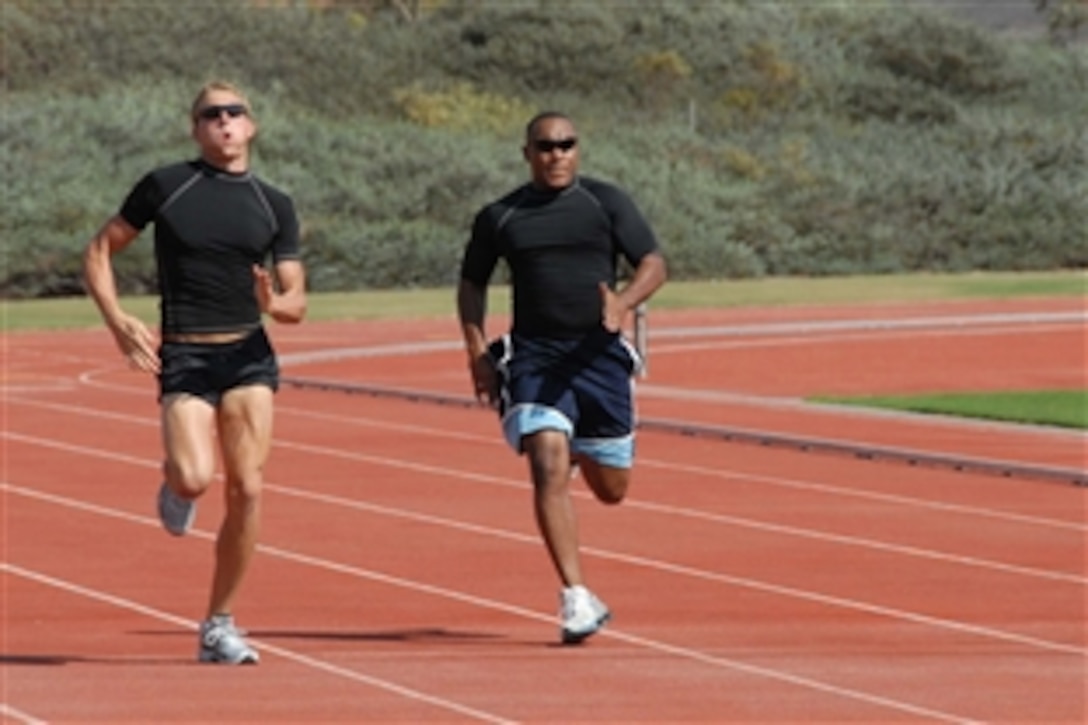 Marine Cpl. Sherman Watson (left), who suffered a traumatic brain injury in Iraq, and Eric McDaniel Jr., a former Army sergeant who suffered a stroke in training at Fort Bragg, N.C., participate in track and field events during the National Veterans Summer Sports Clinic in San Diego. 