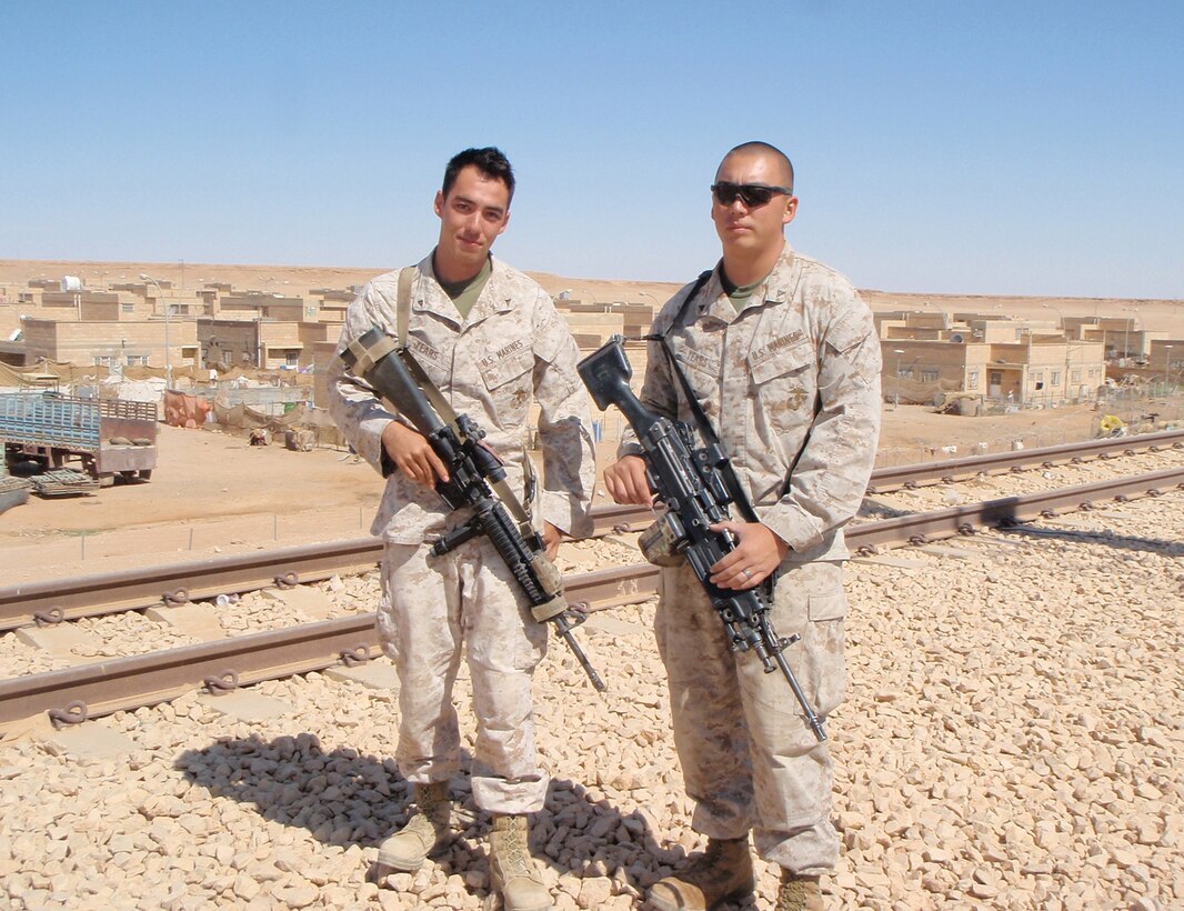 Lance Cpl. David Phillip Years (left) and his brother, Lance Cpl. Christopher William Years, reunited after a long hiatus Oct. 3 at Combat Outpost Akashat in Iraqâ??s western al-Anbar province.  Both reserve Marines, Davidâ??s home unit is Delta Company, 4th Light Armored Reconnaissance Battalion in Quantico, Va.  Christopher is a member of Fox Co., 4th LAR Bn., in Eastover, S.C., which is serving in Iraq as part of 1st LAR Bn., Regimental Combat Team 5, an active duty unit based at Camp Pendleton, Calif.::r::::n::