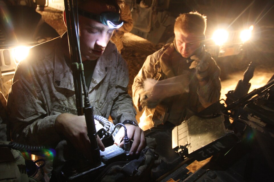 Cpl. Walter Pilkington, a radio operator with Company A, 1st Battalion, 7th Marine Regiment, prepares his radio in the morning hours of Oct. 2 before taking part in a battalion clear of the Combat Center’s military operations in urban terrain facility at range 215. The Marines and sailors learned census patrols as part of the exercise, which are everyday occurrences in Iraq, and involve patrolling and going house-to-house in order to gain a better knowledge of the local community and surroundings, as well as honed their skills in “precision violence,” which is the idea of isolating a threat and dealing with that threat while specifically minimizing collateral damage.::r::::n::::r::::n::