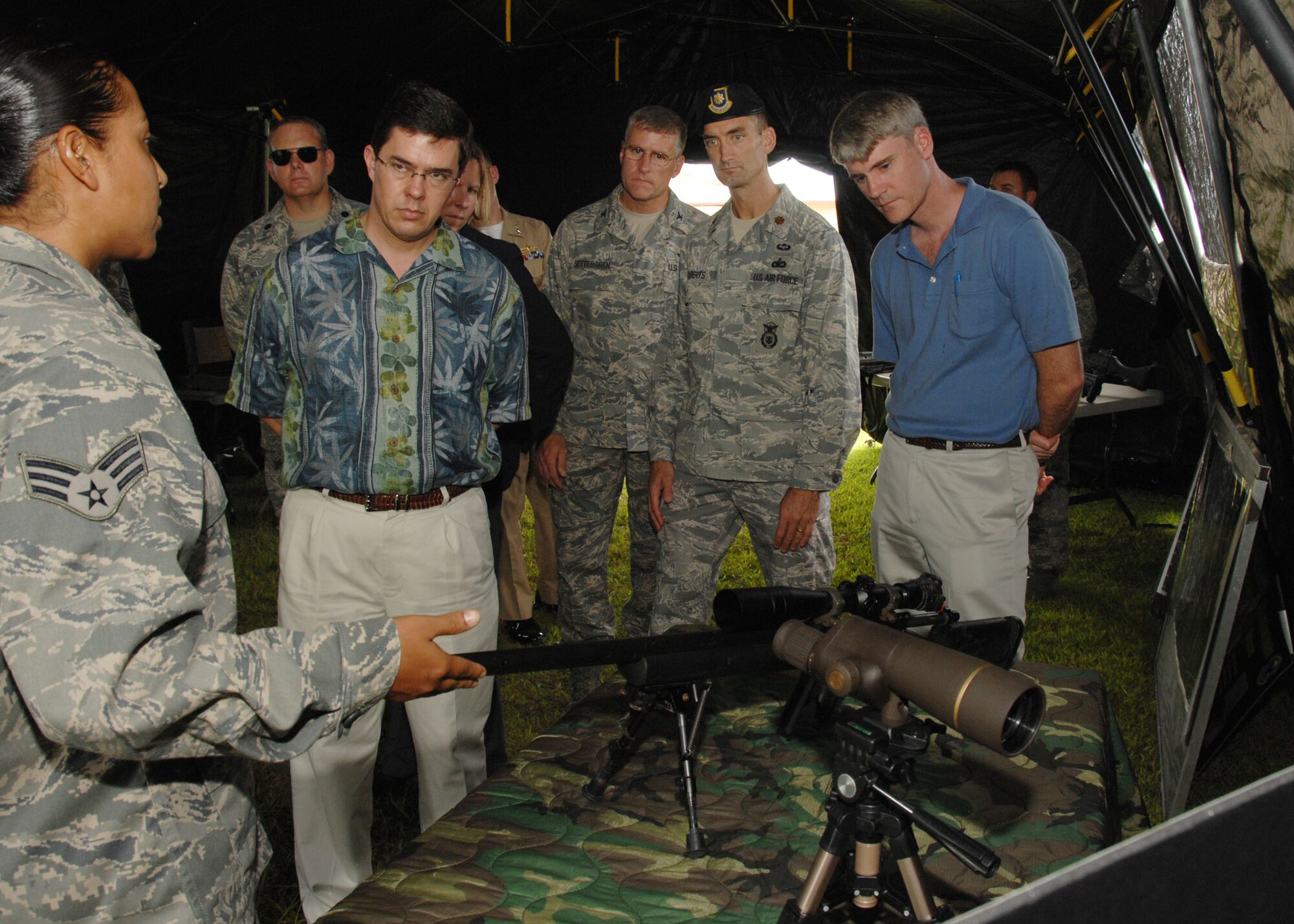 Senior Airman Elizabeth Briones from the 736th Security Forces Squadron explains some of the squadrons capabilities in garrison and deployed Oct 3 here to the Assistant of Security of Defense for Policy Planning Dr. Thomas Mahnken. (U.S. Air Force photo by Airman 1st Class Nichelle Griffiths)