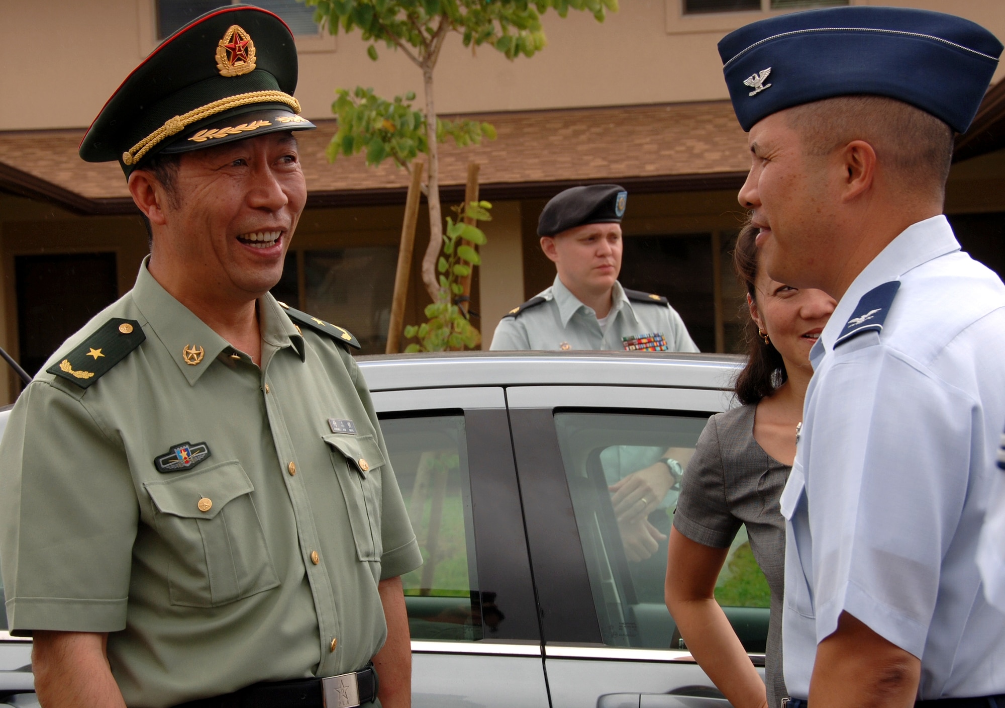 HICKAM AIR FORCE BASE, Hawaii-- Col. Giovanni Tuck, 15th Airlift Wing commander, greets the People's Liberation Army Maj. Gen. Zhong Zhiming, chief of military affairs for the PLA Headquarters General Staff during a Chinese miltary enlisted delgation visit here Oct. 1-2. The visit is part of a continuum of reciprocal exchanges between the United States and China and contributing to the steady progress of our military-to-military relationship-building activities. (U.S. Air Force photo by Vanessa Perez)