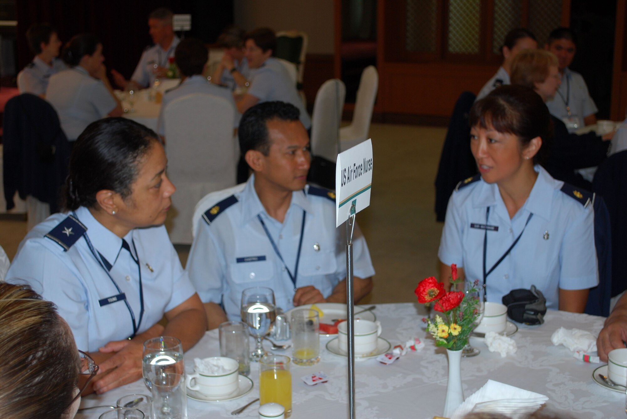 Brig. Gen Jan Young, Air National Guard Assistant to the USAF Assistant Surgeon General, Medical Force Development and Nursing Services, discusses medical issues with with Maj. Edilbert Castro and Maj. Jennifer Sur-Watanabe, Air Force Reserve nurses 624th Aeromedical Staging Squadron, at the second annual Asia Pacific Military Conference. Majors Castro and Sur-Watanabe were two of more than 40 Air Force, Army and Navy nurses and medical professionals who attended the conference with attendees from seven countries Sept. 1-5 at the Korea Armed Forces Nursing Academy in Daejeon, Republic of Korea. The 624th ASTS is part of the 624th Regional Support Group, Hickam Air Force Base, Hawaii.