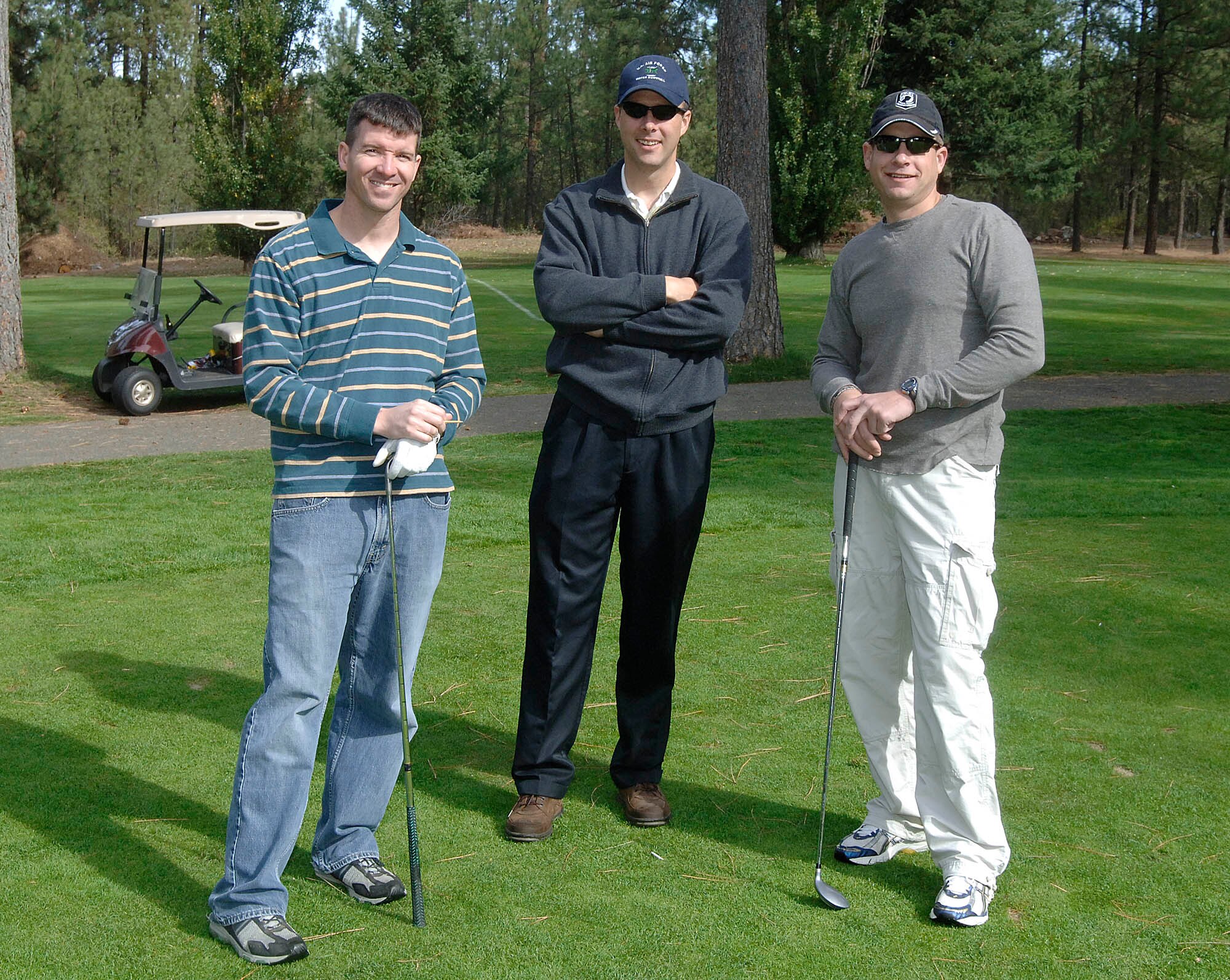 SPOKANE, Wash. – Maj. Curtis Wichers, 36th Rescue Flight commander, Lt. Col. Michael McNerney, 66th Training Squadron director of operations, and Capt. Timothy Hanks, Pacific Air Force Det 166th Training Squadron commander, pose for a photo at Downriver Golf Course Sept. 26. (U.S. Air Force photo / Staff Sgt. JT May III)