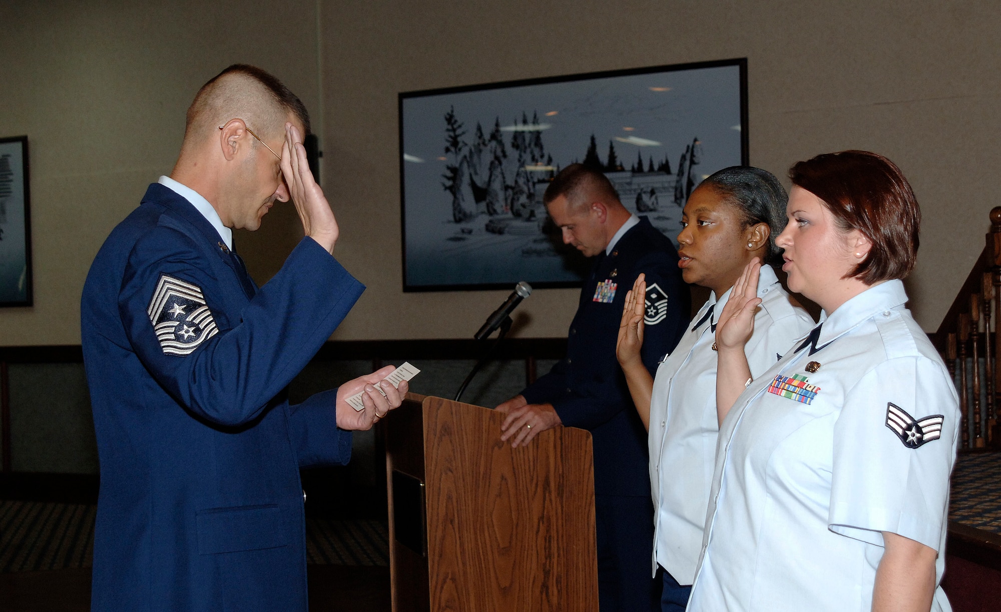 FAIRCHILD AIR FORCE BASE, Wash. – Chief Master Sgt. David Nordel, 92nd Air Refueling Wing command chief, leads newly promoted staff sergeants in the non-commissioned officer charge during the Wing Promotion Ceremony at Club Fairchild Sept. 30. (U.S. Air Force photo / Staff Sgt. JT May III)