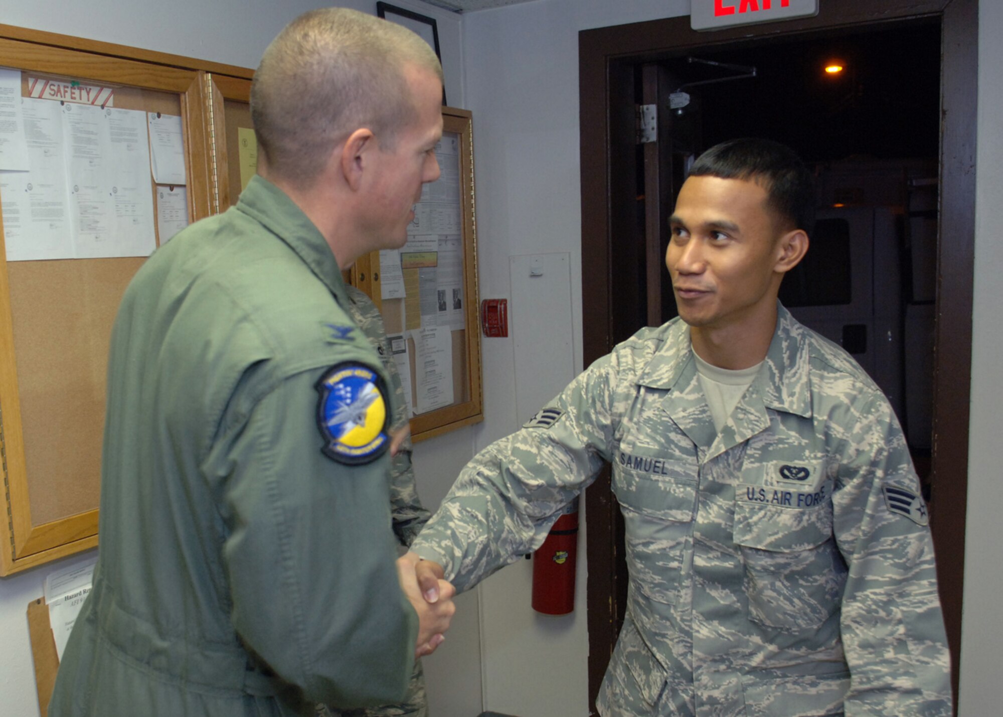 Col. Michael McGee, 49th Fighter Wing vice commander, welcomes home Senior Airman Michael Samuel, 49th Civil Engineer Squadron, September 30, at Holloman Air Force Base.  Airman Samuel was deployed to Kirkuk Air Force Base for four months.  (U.S. Air Force photo by Airman 1st Class John D. Strong II)