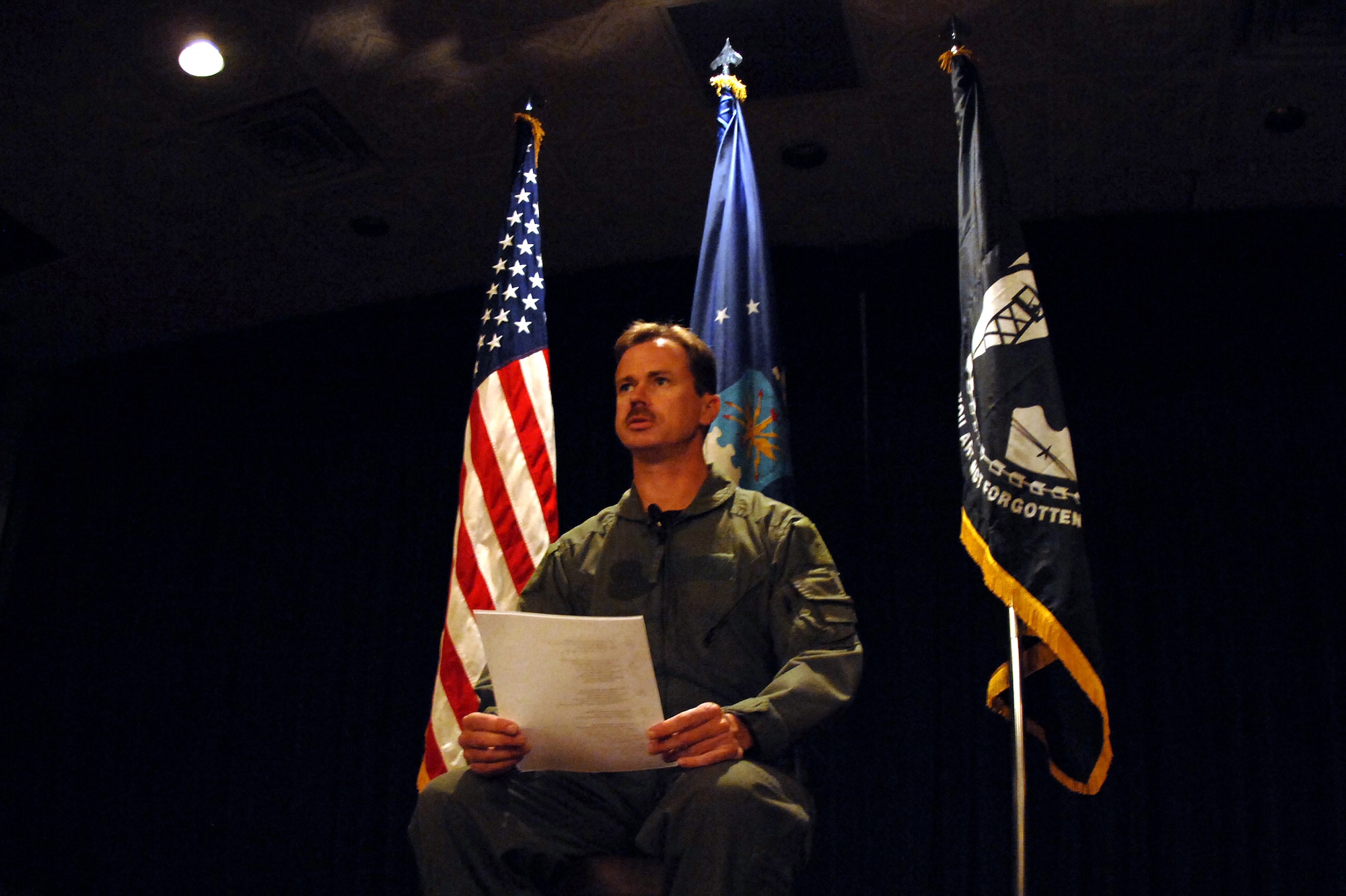 Master Sgt. Donald Van Buskrik, a productions superintendent from the 55th Aircraft Maintenance Squadron, performs a special POW/MIA presentation to end the 14th Annual First Sergeants Association's POW/MIA Recognition Ceremony at the Patriot Club here Sept. 29. Sergeant Van Buskrik performed a dramatic monologue that portrayed the experience of a prisoner of war in honor of those who have suffered as a prisoner of war or while missing in action. (U.S. Air Force Photo By Josh Plueger)