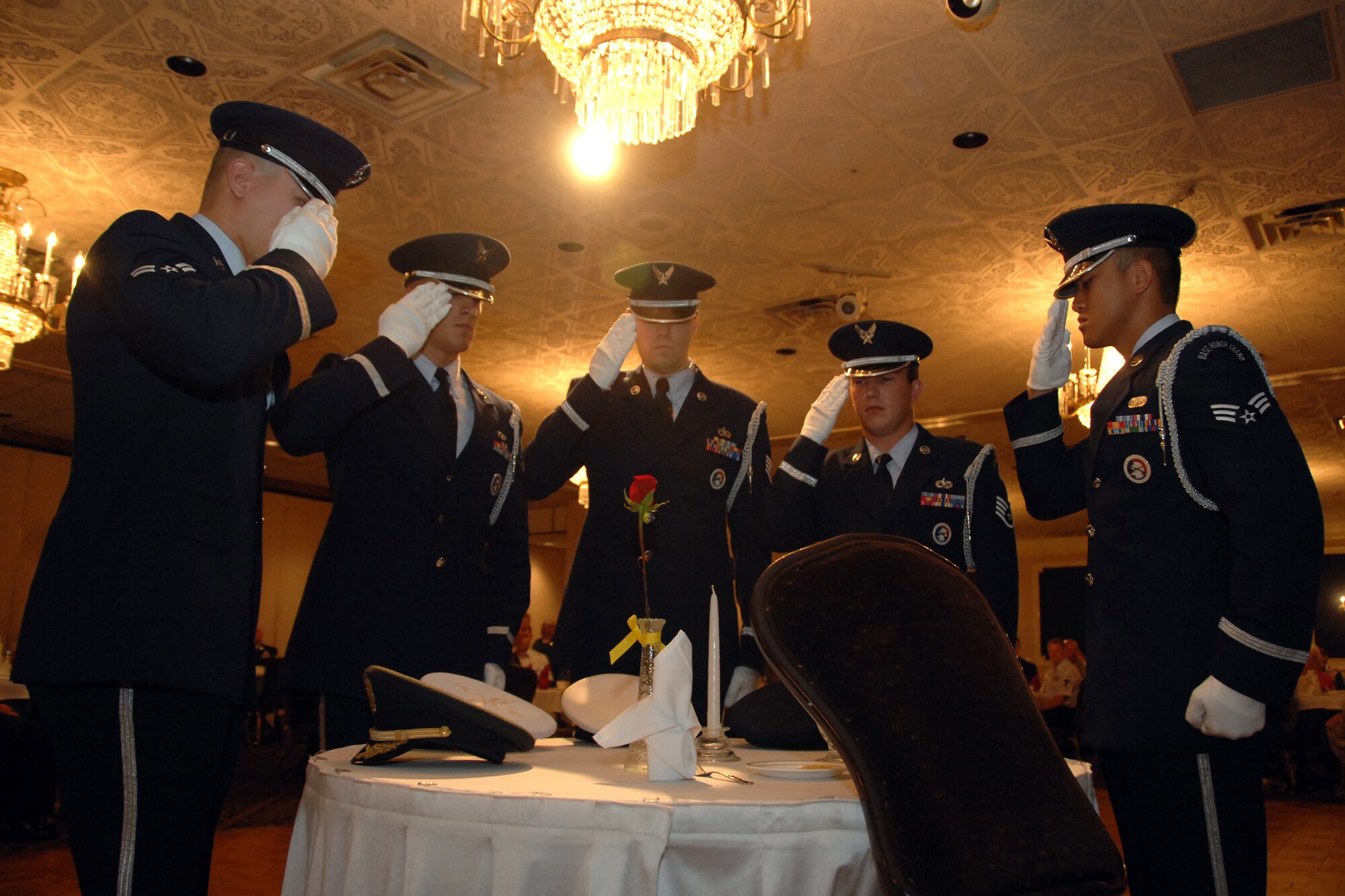 Members of Offutt AFB’s Honor Guard salute those who gave all as prisoners of war or military personnel missing in action during the 14th Annual First Sergeants Association's POW/MIA Recognition Ceremony at the Patriot Club here Sept. 29. (U.S. Air Force Photo By Josh Plueger)