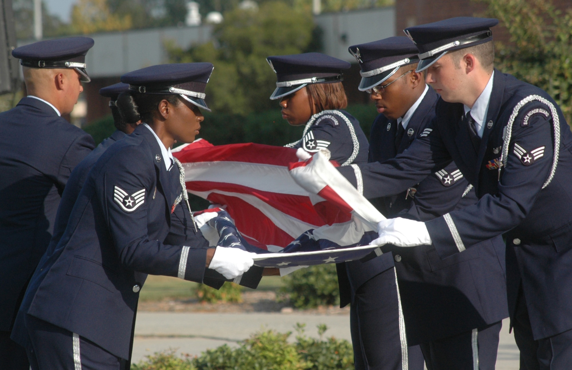 Members of Robins Honor Guard fold the flag at a formal retreat Sept. 29 honoring the 60th Anniversary of the integration of the United States Armed Forces. U. S. Air Force photo by Sue Sapp