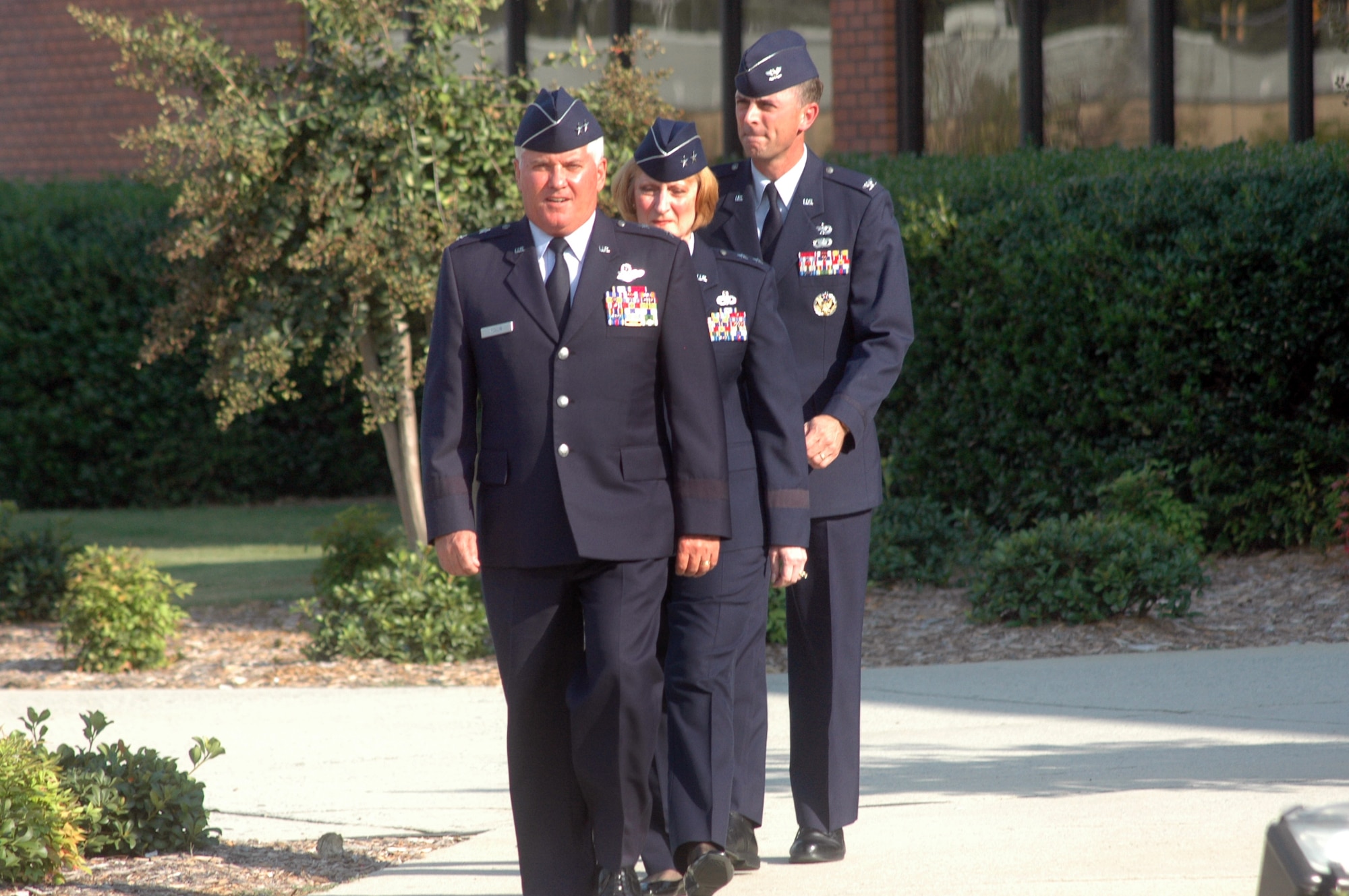 Maj. Gen. Allan R. Poulin, Air Force Reserve Command vice commander, Maj. Gen. Polly A. Peyer, Warner Robins Air Logistics Center commander, and Col. Warren D. Berry, 78th Air Base Wing commander arrive at  a formal retreat Sept. 29 honoring the 60th Anniversary of the integration of the United States Armed Forces. U. S. Air Force photo by Sue Sapp