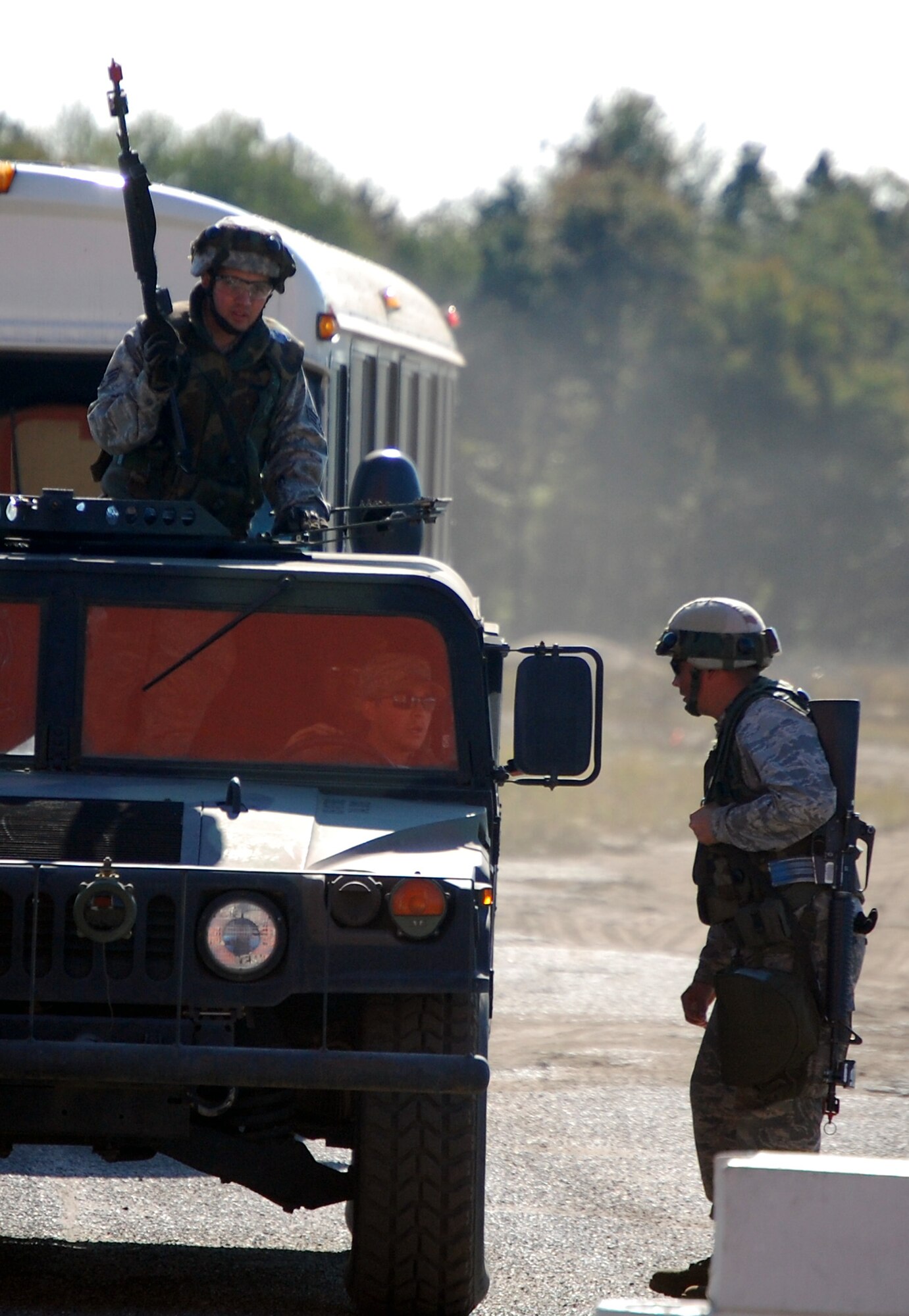 Airmen deployed to Air Force Exercise Eagle Flag 08-6 set up security at an entry control point during exercise operations at Naval Air Engineering Station Lakehurst, N.J., Sept. 23, 2008.  The exercise, managed by the U.S. Air Force Expeditionary Center's 421st Combat Training Squadron at Fort Dix, N.J., tests and trains Airmen in expeditionary combat support skills.  (U.S. Air Force Photo/Tech. Sgt. Scott T. Sturkol)