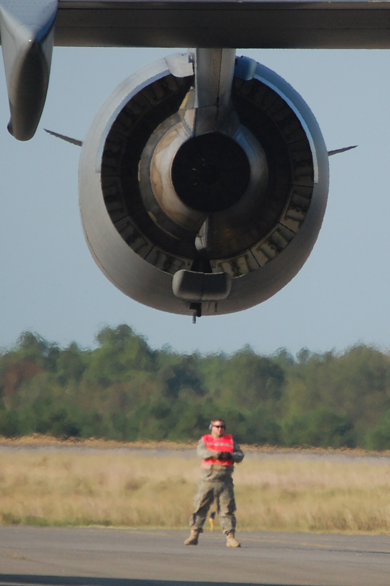 An aircrew member waits by his C-17 Globemaster III in preparation for it to be loaded during operations for Air Force Exercise Eagle Flag 08-6 Sept. 23, 2008, at Naval Air Engineering Station Lakehurst, N.J.  The C-17, from McGuire Air Force Base, N.J., was loading up equipment from the 816th Contingency Response Group, also from McGuire.  Eagle Flag is operated by the U.S. Air Force Expeditionary Center's 421st Combat Training Squadron at Fort Dix, N.J.  (U.S. Air Force Photo/Tech. Sgt. Scott T. Sturkol)