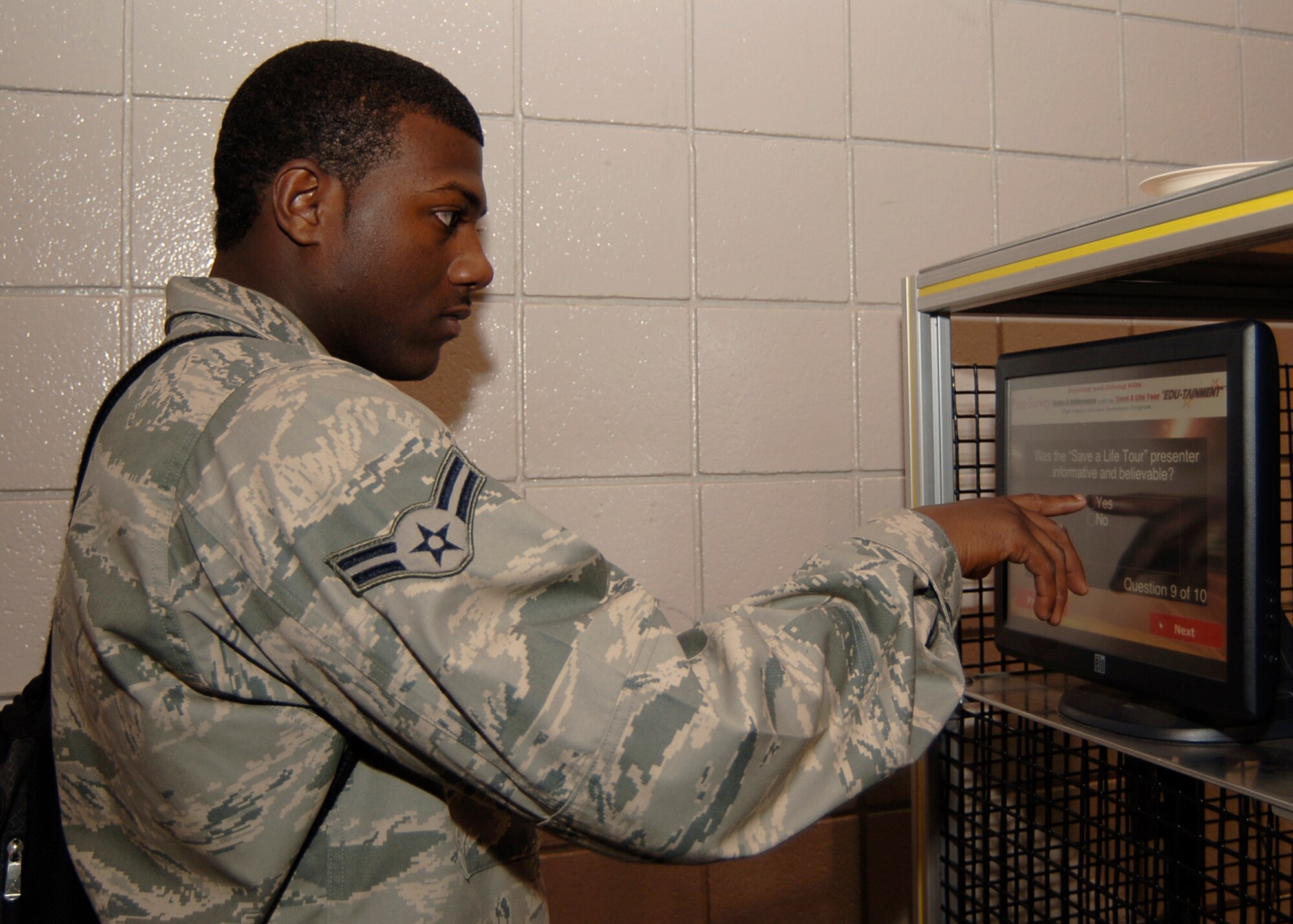 MCCONNELL AIR FORCE BASE, Kan. -- Airman 1st Class Cody Noble, 22nd Force Support Squadron, takes a post-survey about the “Save a Life” tour after his drunken driving simulator session, Sept 30. The post-survey asked about the impact the session had on decisions involving drunk driving and “more or less likely” situations dealing with driving under the influence. (Photo by Airman 1st Class Maria Ruiz)