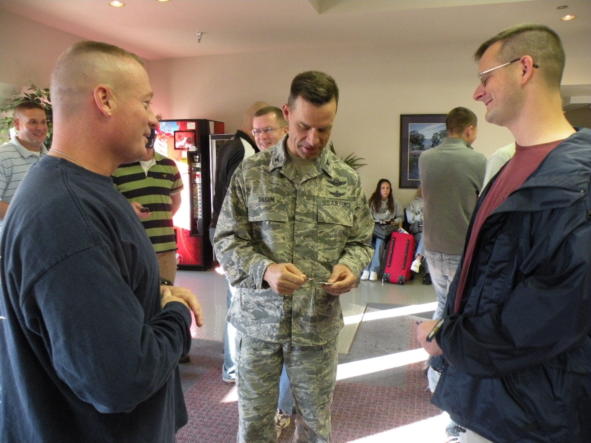 Lieutenant Colonel Paul Issler (left), 311th Training Squadron commander, and Lt. Col. Jon Rice (right), 314th Training Squadron commander, thank Col. Mark Dillon, 60th Air Mobility Wing commander, for the flight from Travis Air Force Base, Calif., to Wright-Patterson Air Force Base, Ohio, for the Air Force Marathon. (U.S. Air Force photo by Master Sgt. Cunard Smith)