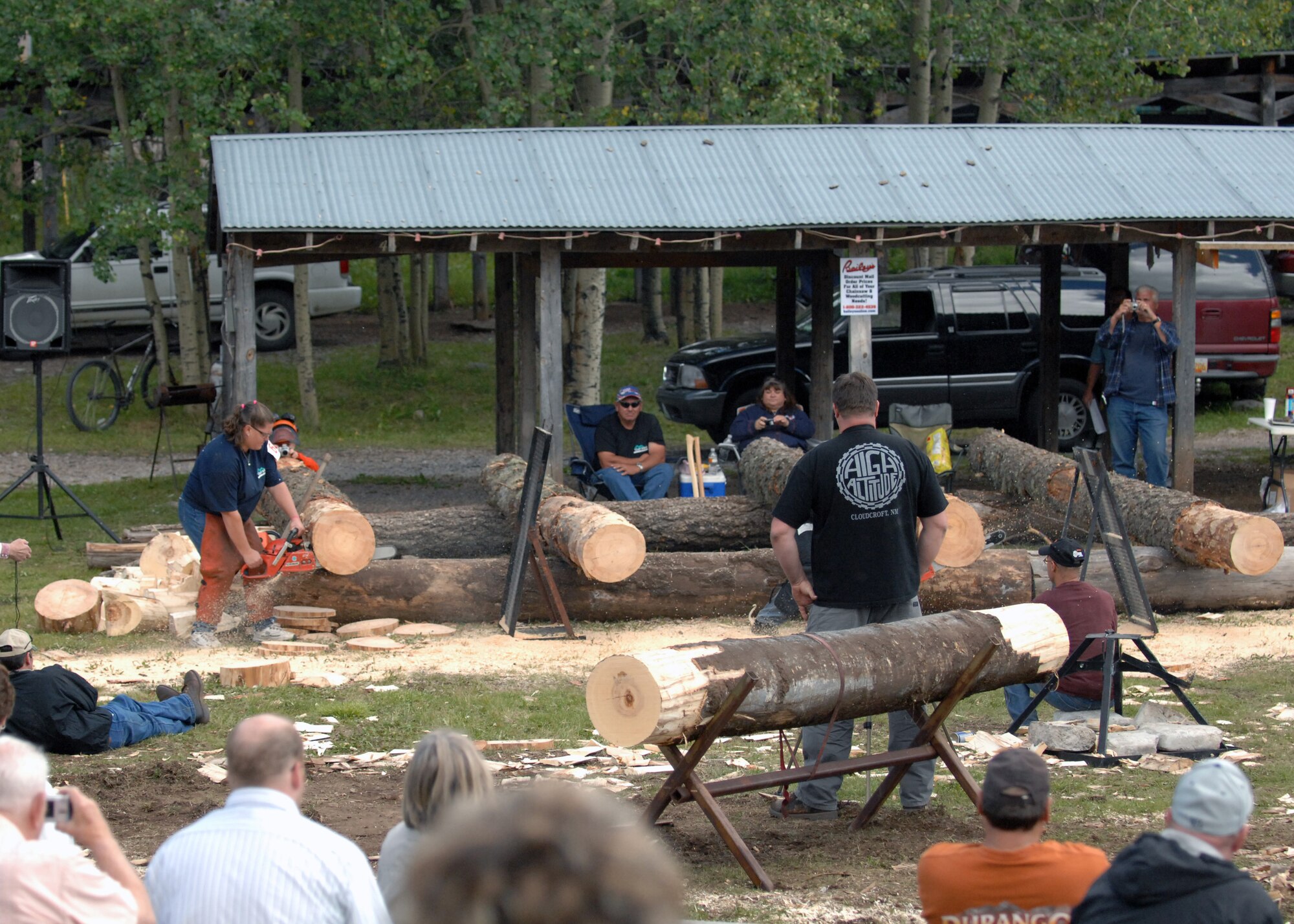 Dana Lenzo, competitor in Lumberjack Day, chops off pieces of pinewood at Zenith park in Cloudcroft, N.M., September 20. Judges and the audience watched as the lumberjack contestants competed in more than 18 events against one another to win first prize. (U.S. Air Force photo/Airman 1st. Class Veronica Salgado)