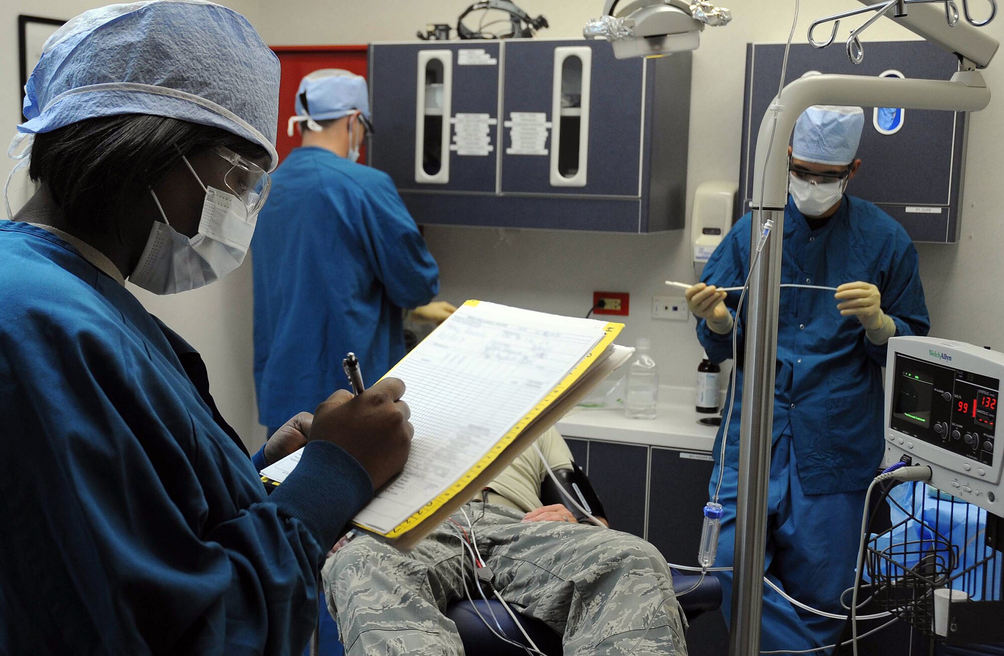 CANNON AIR FORCE BASE, N.M. -- Staff Sgt. Tiawanna Izaguirre, 27th Special Operations Aerospace Medical Squadron, monitors a patient's vital signs during dental surgery Sept. 30. The 27th SOAMDS provides services for more than 5,000 Airmen and their families.  (U.S. Air Force photo/Senior Airman Liliana Moreno) 