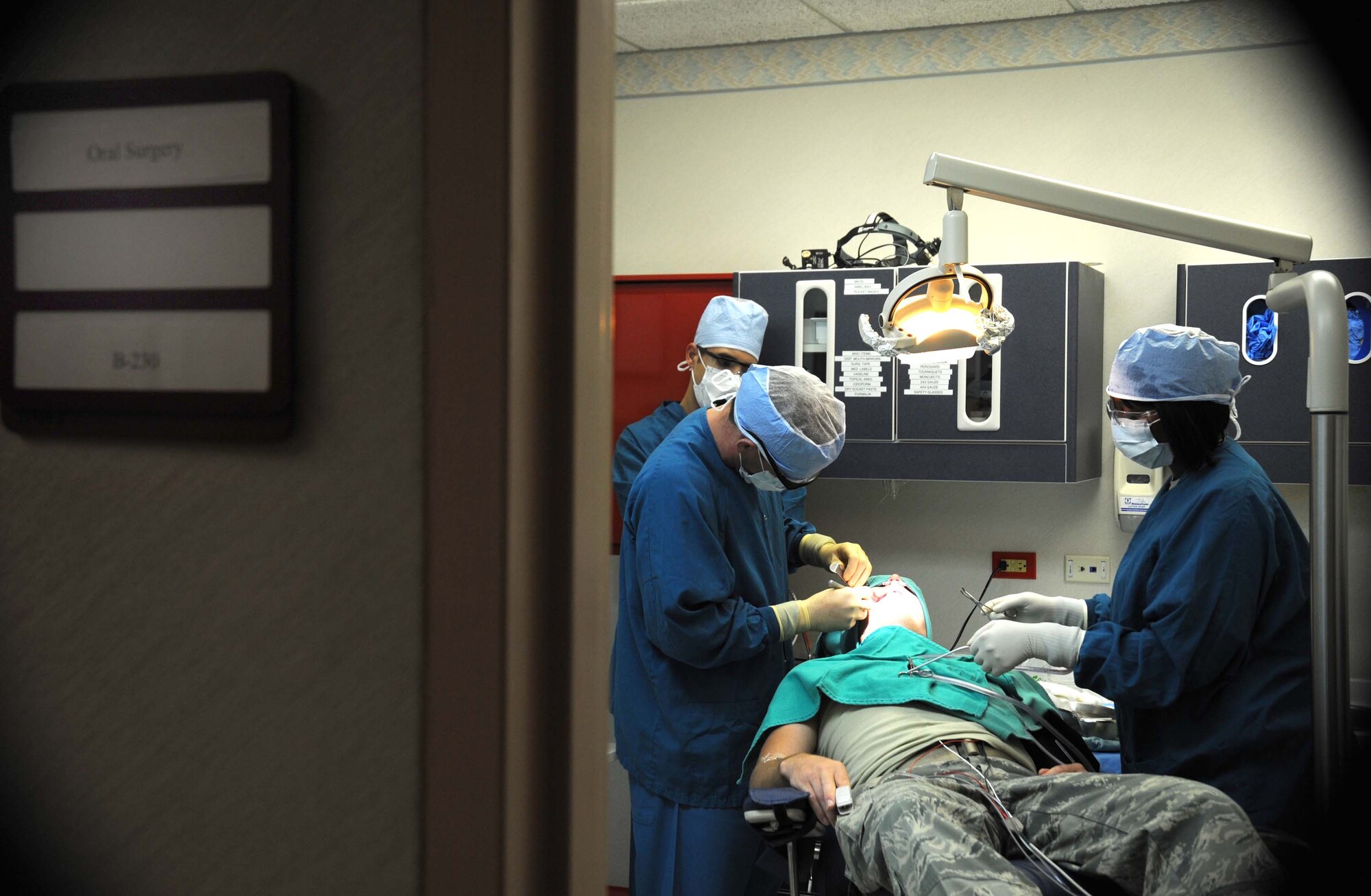 CANNON AIR FORCE BASE, N.M. -- Capt. Michael Hoge and Staff Sgt. Tiawanna Izaguirre, 27th Special Operations Aerospace Medical Squadron, perform dental surgery Sept. 30. The 27th SOAMDS provides services for more than 5,000 Airmen and their families.  (U.S. Air Force photo/Senior Airman Liliana Moreno) 