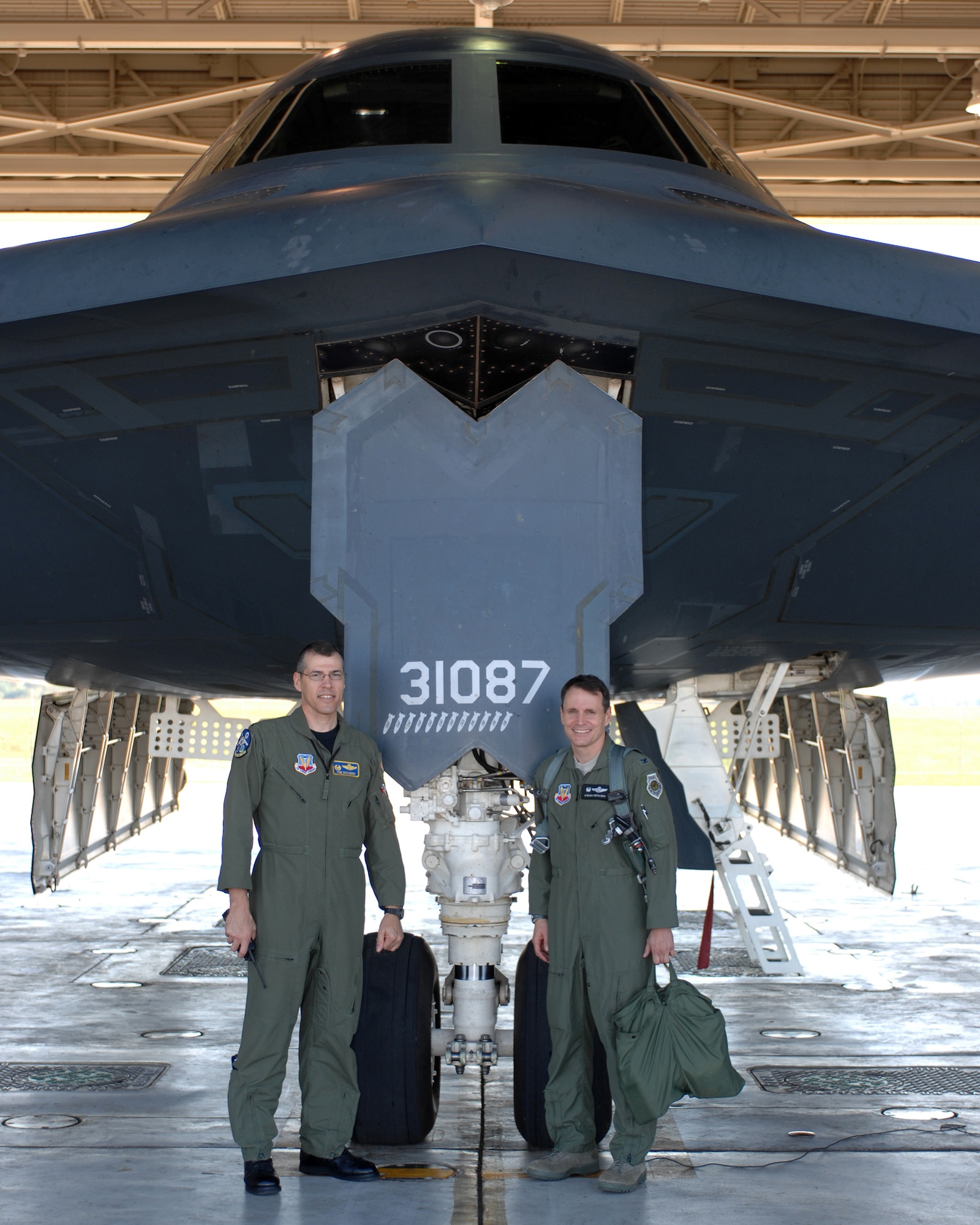 Col. Steven Depalmer, 53d Wing commander poses with Col. Thomas Bussiere, 509th Operations Group commander, prior to his departure in a B-2 Spirit Sept. 18.  Colonel DePalmer's flight was part of his immersion with the 72nd Test and Evaluation Squadron, a test squadron part of the 53d Wing but located at Whiteman Air Force Base Missouri.  The commander will eventually fly the B-1 and B-52 during his immersion with other squadrons in his wing.  The 53d Wing has 17 geographically separated units throughout the U.S.  (U.S. Air Force photo/Staff Sgt Charles D. Larkin Sr.)