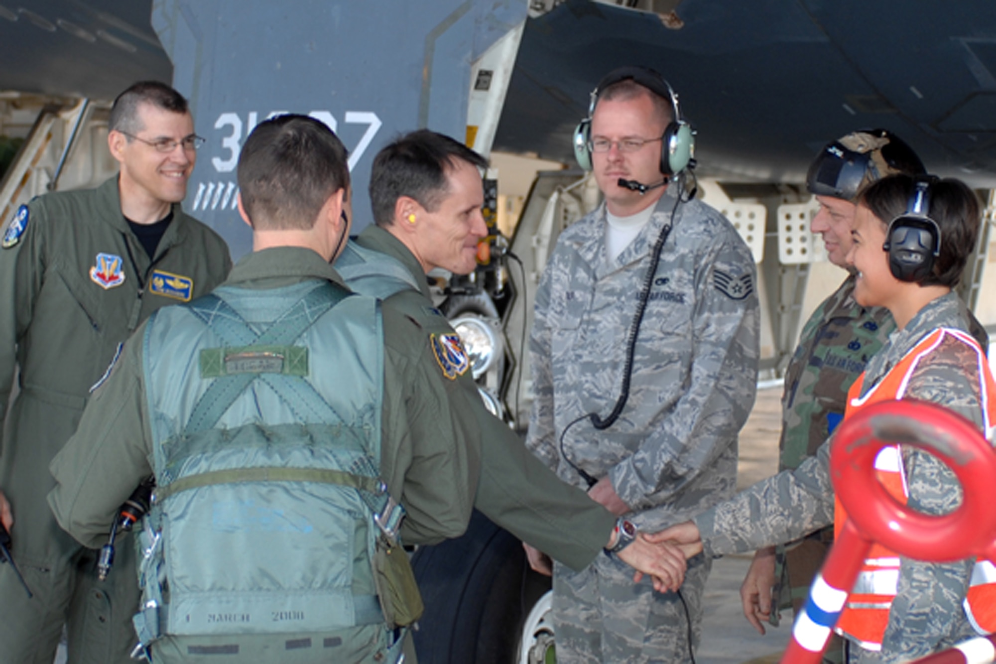 Col. Steven Depalmer, 53d Wing commander greets members of the 509th Aircraft Maintenace Squadron prior to his departure in a B-2 Spirit Sept. 18.  Colonel DePalmer's flight was part of his immersion with the 72nd Test and Evaluation Squadron, a test squadron part of the 53d Wing but located at Whiteman Air Force Base Missouri.  The commander will eventually fly the B-1 and B-52 during his immersion with other squadrons in his wing.  The 53d Wing has 17 geographically separated units throughout the U.S.  (U.S. Air Force photo/Staff Sgt Charles D. Larkin Sr.)