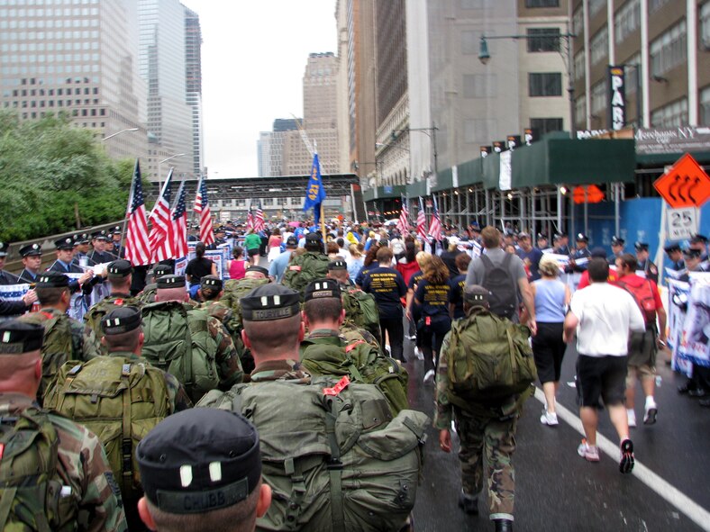 A formation of 421st Combat Training Squadron cadre with 55 pounds strapped to their backs presses toward the finish line during the Tunnel to Towers 5-kilometer Run/Walk in New York City Sept. 28, 2008. The Tunnel to Towers is a fundraiser in tribute to Stephen Siller, a New York City firefighter who gave his life on Sept. 11, 2001. Siller ran from his vehicle in full firefighter gear from the Brooklyn Battery Tunnel to the World Trade Center when he heard of the disaster over his scanner. Siller had just come off duty and was headed for a round of golf. (U.S. Air Force photo/Staff Sgt. Paul R. Evans)