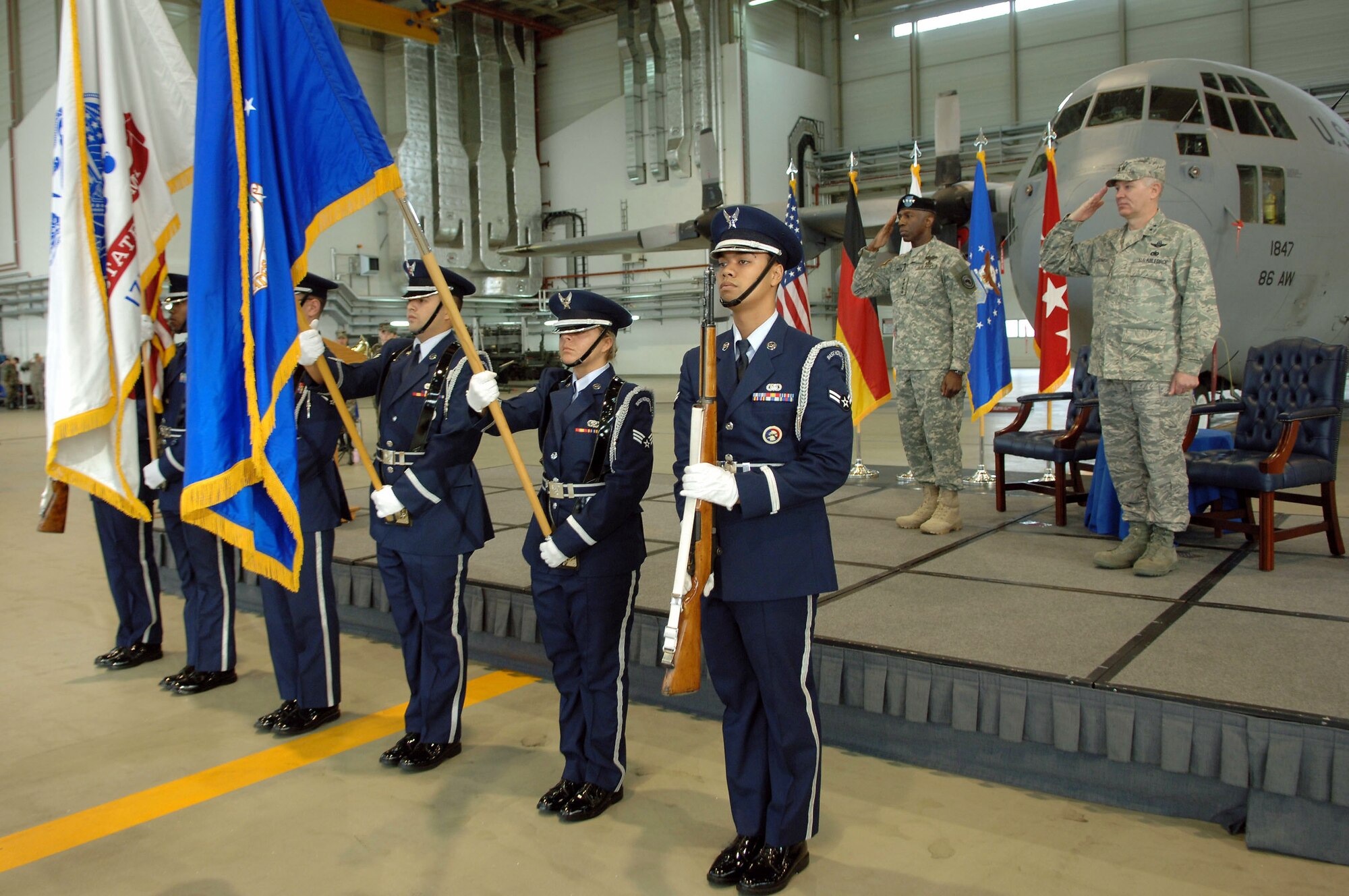 Army Gen. William E. "Kip" Ward (left), U.S. Africa Command commander, and Maj. Gen. Ronald R. Ladnier, commander of 17th Air Force, salute the colors as the national anthem is sung during an assumption of command ceremony Sept. 18 at Ramstein Air Base, Germany.  General Ladnier took the guidon for 17th AF, which officially activates Oct. 1 and will serve as the air component for AFRICOM. (U.S. Air Force photo/Airman 1st Class Tony R. Ritter)