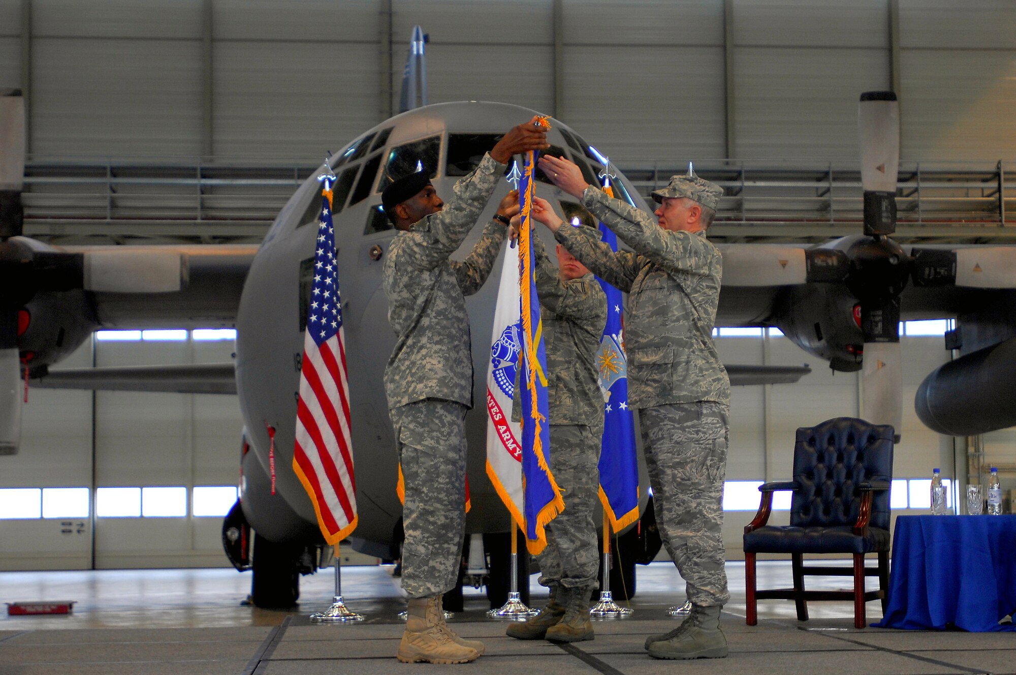 Army Gen. William E. "Kip" Ward (left), U.S. Africa Command commander, and Maj. Gen. Ronald R. Ladnier, commander of 17th Air force, unfurl the 17th AF guidon during an assumption-of-command ceremony Sept. 18 at Ramstein Air Base, Germany. General Ladnier took the guidon for 17th AF, which officially activates Oct. 1 and will serve as the air component for AFRICOM.  (U.S. Air Force photo/Airman 1st Class Kenny Holston)