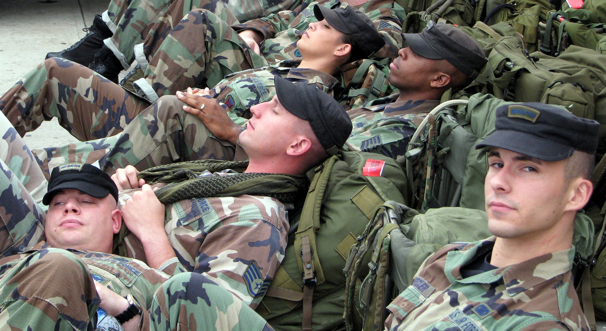 After waking up in the early hours to get to New York City from Fort Dix, N.J., some members of the U.S. Air Force Expeditionary Center's 421st Combat Training Squadron elect to get a few more winks of sleep prior to marching 5 kilometers with a 55-pound ruck sack for the Tunnel to Towers 5K Run/Walk Sept. 28 208. The Tunnel to Towers is a fundraiser in tribute to Stephen Siller, a New York City firefighter who gave his life on Sept. 11, 2001.  Siller ran from his vehicle in full firefighter gear from the Brooklyn Battery Tunnel to the World Trade Center when he heard of the disaster over his scanner. Siller had just come off duty and was headed for a round of golf. (U.S. Air Force Photo/Staff Sgt. Paul R. Evans)