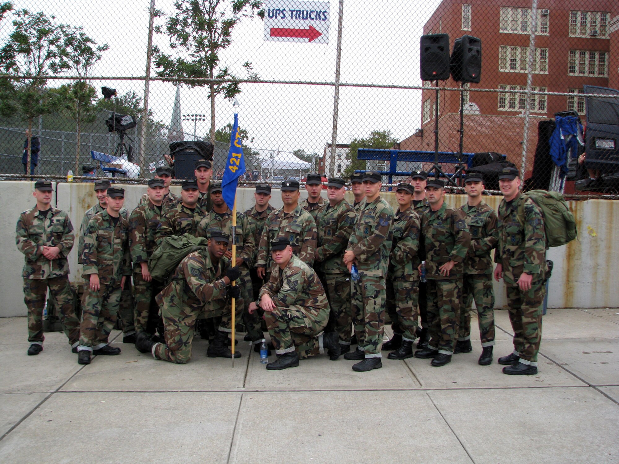 Twenty-one cadre members of the 421st Combat Training Squadron from the U.S. Air Force Expeditionary Center at Fort Dix, N.J. gather for a pre-event photo for the Tunnel to Towers 5-kilometer Run/Walk in New York City Sept. 28, 2008. The Tunnel to Towers is a fundraiser in tribute to Stephen Siller, a New York City firefighter who gave his life on Sept. 11, 2001.  Siller ran from his vehicle in full firefighter gear from the Brooklyn Battery Tunnel to the World Trade Center when he heard of the disaster over his scanner. Siller had just come off duty and was headed for a round of golf. (U.S. Air Force photo/Staff Sgt. Paul R. Evans)