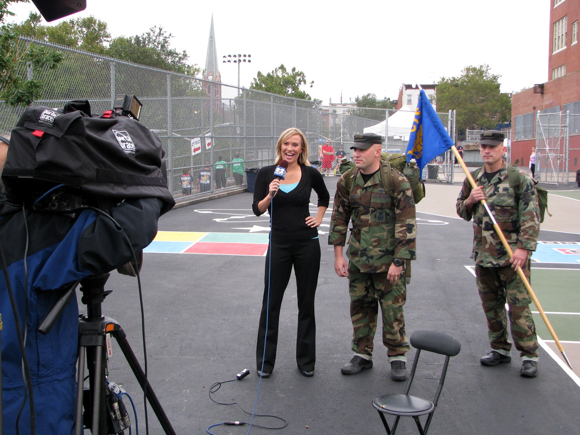Staff Sgt. Anthony Richards representing the 421st Combat Training Squadron, U.S. Air Force Expeditionary Center, Fort Dix, N.J. is interviewed by Ms. Katie McGee from WCBS Channel 2 prior to participation in the Tunnel to Towers 5K Run/Walk in New York, N.Y. 28 Sep 08. The Tunnel to Towers 5-kilometer run/walk is a fundraiser in tribute to Stephen Siller, a New York City firefighter who gave his life on Sept. 11, 2001.  Siller ran from his vehicle in full firefighter gear from the Brooklyn Battery Tunnel to the World Trade Center when he heard of the disaster over his scanner. Siller had just come off duty and was headed for a round of golf. (U.S. Air Force Photo/Staff Sgt. Paul R. Evans)