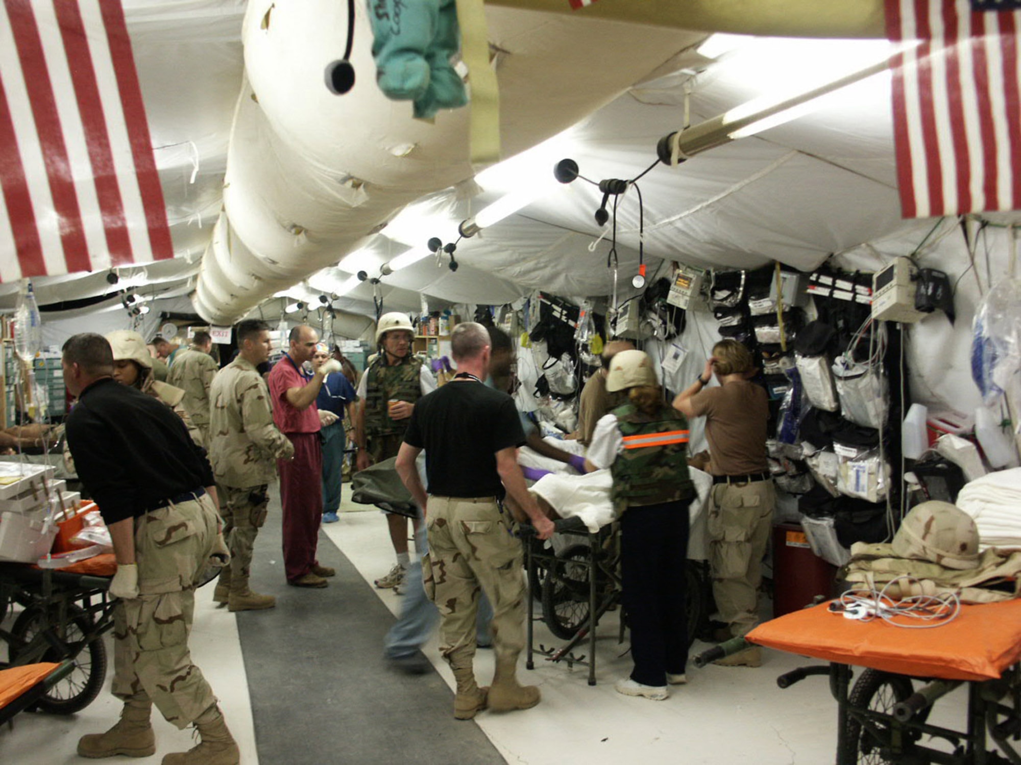 Medics assigned to the Air Force Theater Hospital treat emergency room patients Nov. 4, 2004, at Joint Base Balad, Iraq. Approximately 80 percent of Air Force doctors and medics are trained in trauma care at Wilford Hall Medical Center's Level One Trauma Center in San Antonio. (U.S. Air Force photo) 
