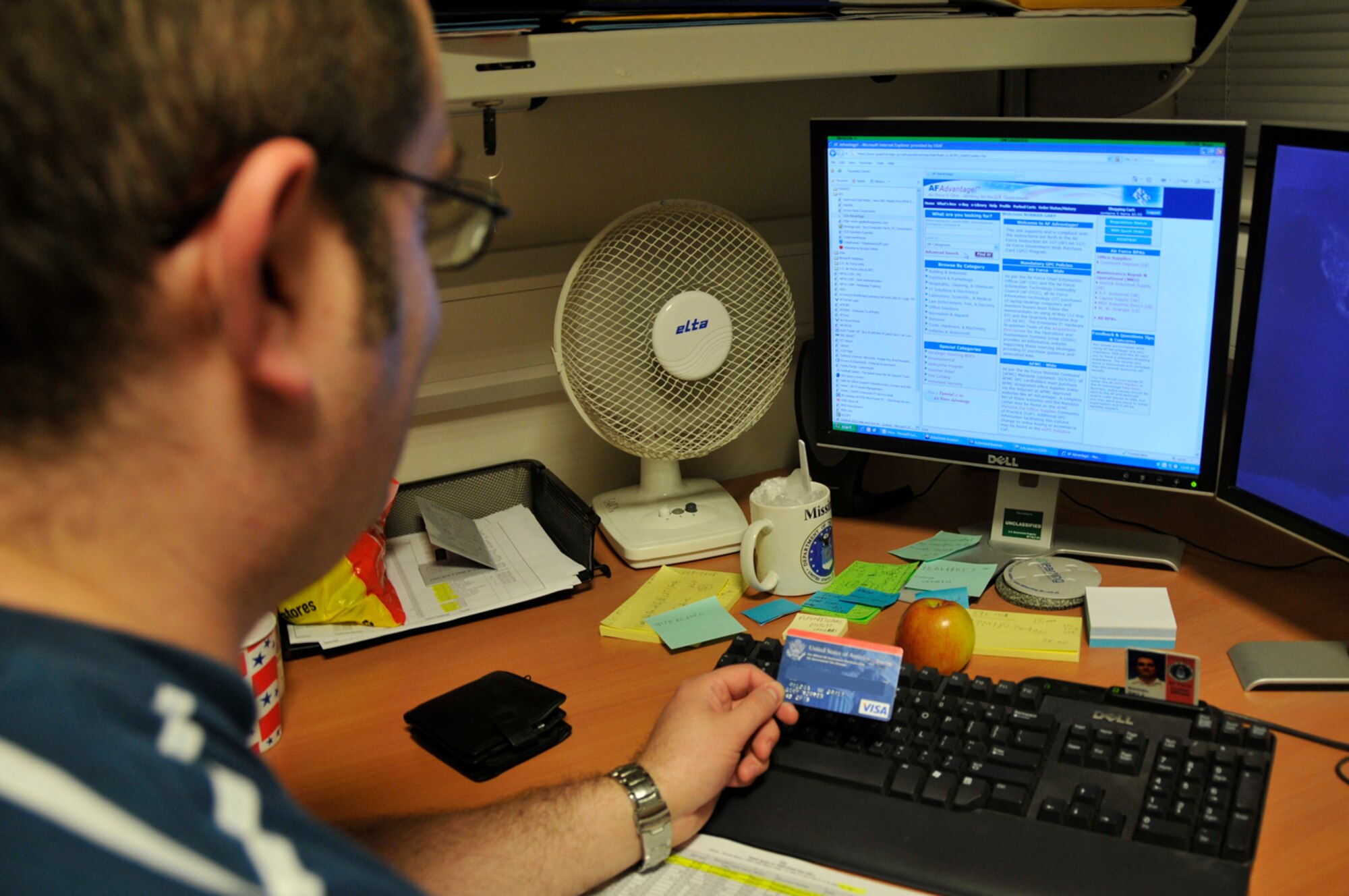Gary Norman, 48th Comptroller Squadron budget analysis for the 48th Medical Group, prepares to make a Goverment Card Purchase Oct. 1 at RAF Lakenheath, England. 48th CPTS personnel stayed in the office until 3 a.m. to put the finishing touches on funds that were allocated to the wing throughout the fiscal year 2008. (U.S. Air Force photo by Airman 1st Class Perry Aston)
