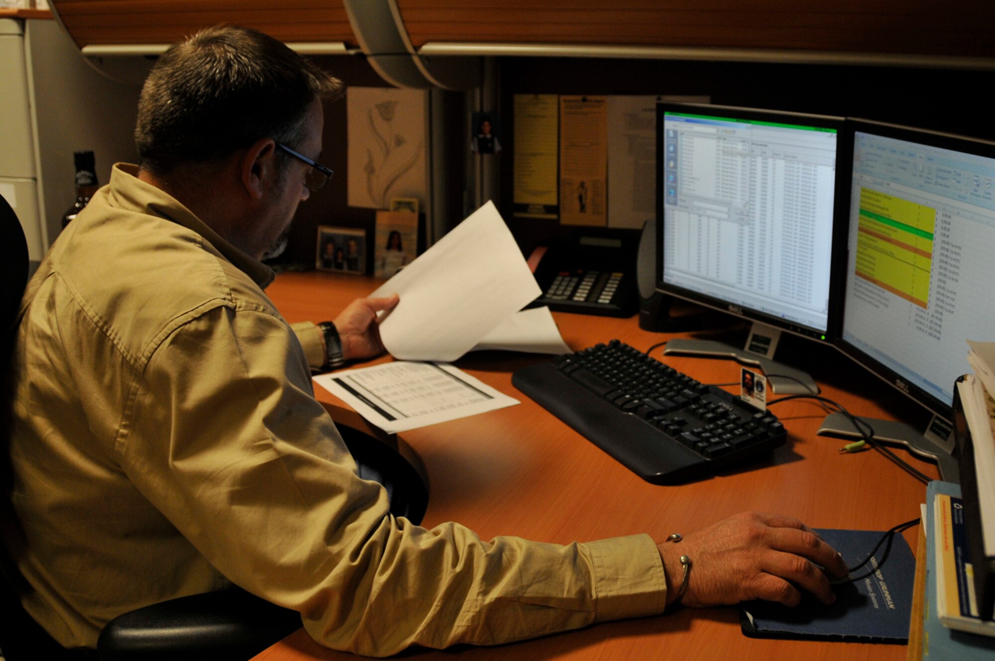 Jim Baker, 48th Comptroller Squandron, Deputy Flight Chief of finacial analysis, balances out the year-end budget Sept. 30 at RAF Lakenheath, England. Mr. Baker must ensure the office's numbers match what is in the accounting system (U.S. Air Force photo by Airman 1st Class Perry Aston)