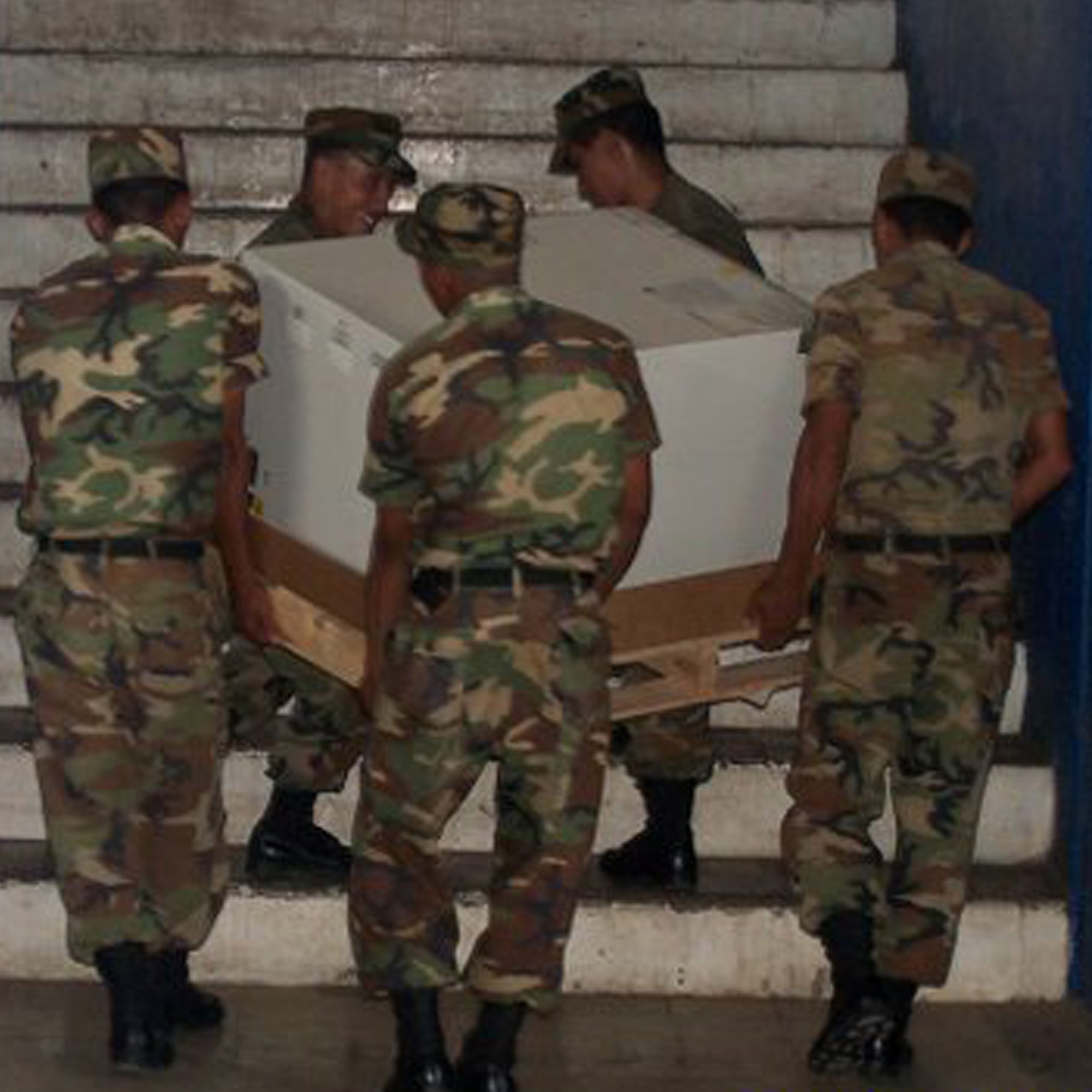 The El Salvadorian army assists in carrying equipment to set up a mobile dental clinic.  The first all-dental team participated in a readiness exercise in Zacatecoluca, El Salvador. Eighteen dentists and technicians from Barksdale, Lackland, Langley and Eglin Air Force Bases supported the exercise Sept. 6-20. (courtesy photo) 