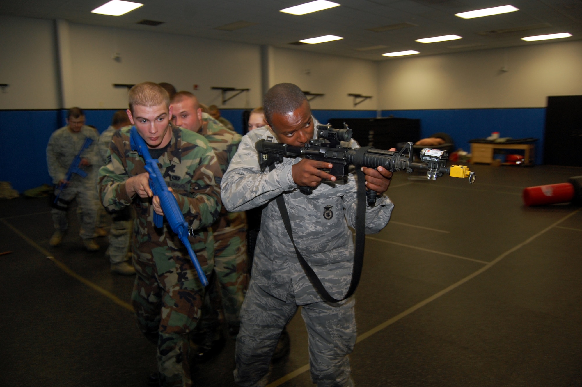Students in the Air Force Phoenix Warrior Training Course learn close quarters combat tactics during a class session in the U.S. Air Force Expeditionary Center Sept. 22, 2008, on Fort Dix, N.J.  Phoenix Warrior, taught by the center's 421st Combat Training Squadron, is a security forces functional pre-deployment training course focusing on tactics, techniques and procedures unique to the deployed environment.  (U.S. Air Force Photo/Tech. Sgt. Scott T. Sturkol)