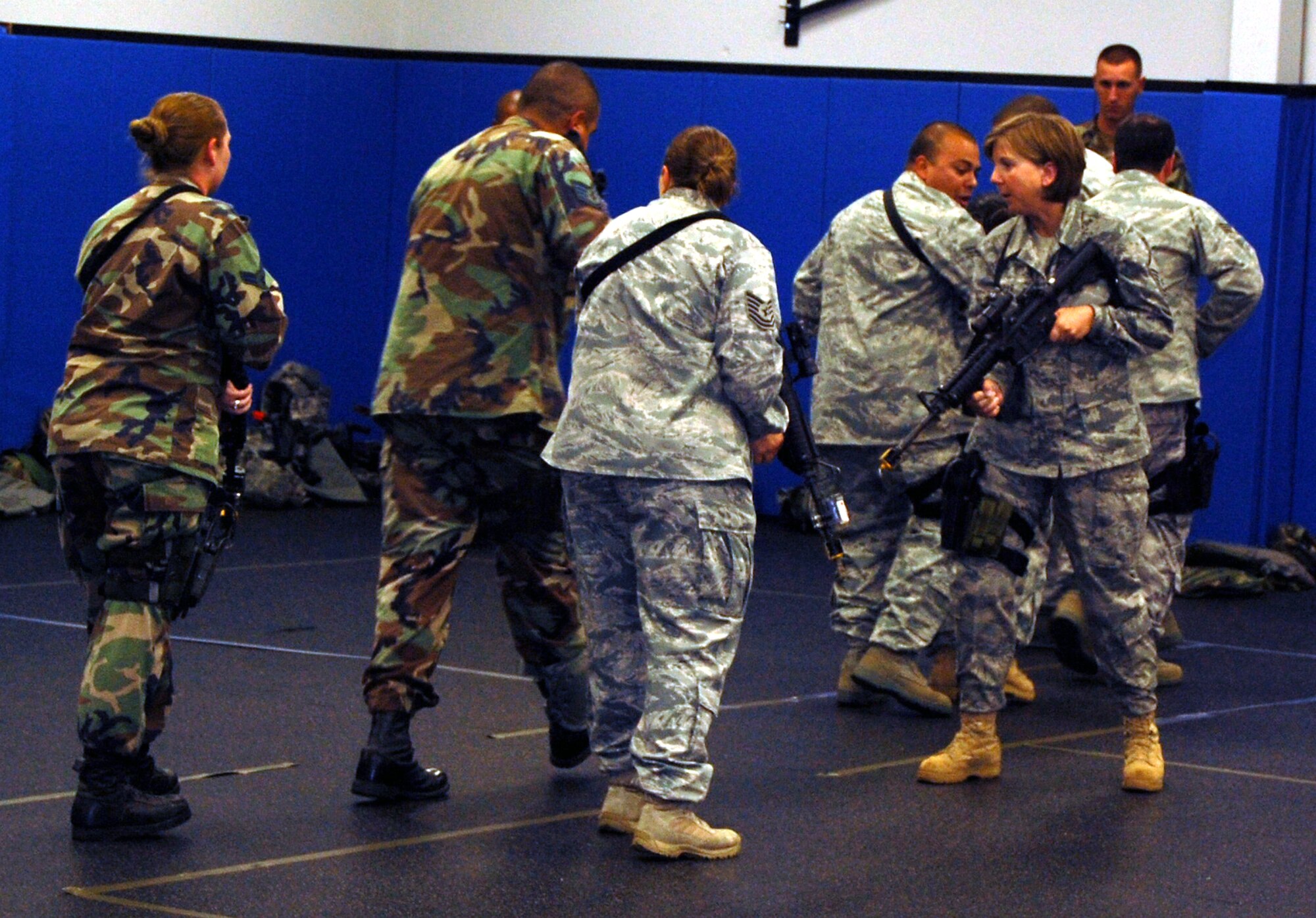 Students in the Air Force Phoenix Warrior Training Course learn close quarters combat tactics during a class session in the U.S. Air Force Expeditionary Center Sept. 22, 2008, on Fort Dix, N.J.  Phoenix Warrior, taught by the center's 421st Combat Training Squadron, is a security forces functional pre-deployment training course focusing on tactics, techniques and procedures unique to the deployed environment.  (U.S. Air Force Photo/Tech. Sgt. Scott T. Sturkol)