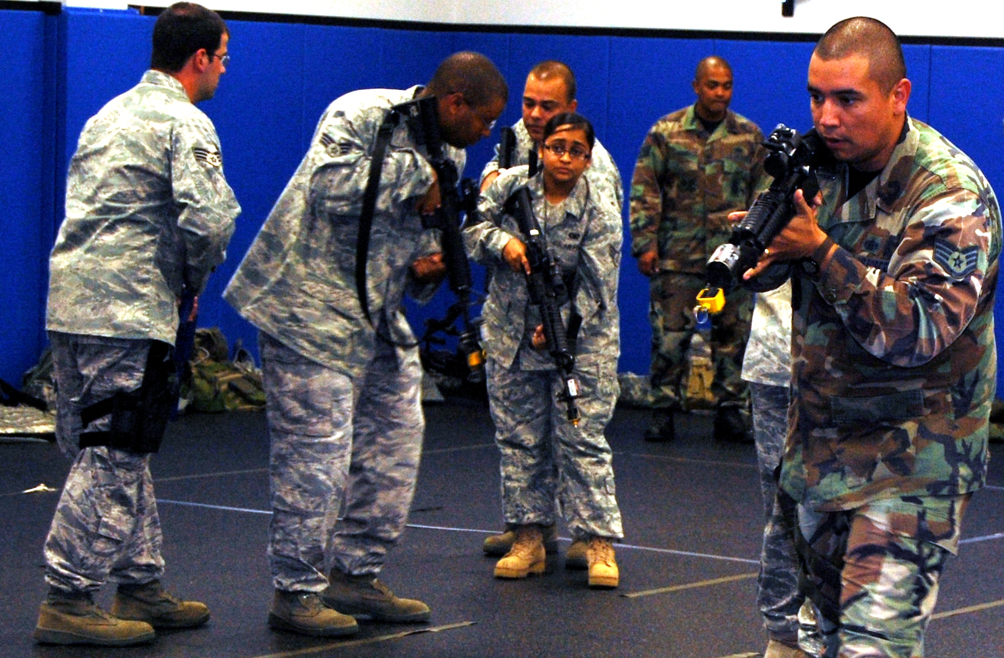 Students in the Air Force Phoenix Warrior Training Course learn close quarters combat tactics during a class session in the U.S. Air Force Expeditionary Center Sept. 22, 2008, on Fort Dix, N.J.  Phoenix Warrior, taught by the center's 421st Combat Training Squadron, is a security forces functional pre-deployment training course focusing on tactics, techniques and procedures unique to the deployed environment.  (U.S. Air Force Photo/Tech. Sgt. Scott T. Sturkol)